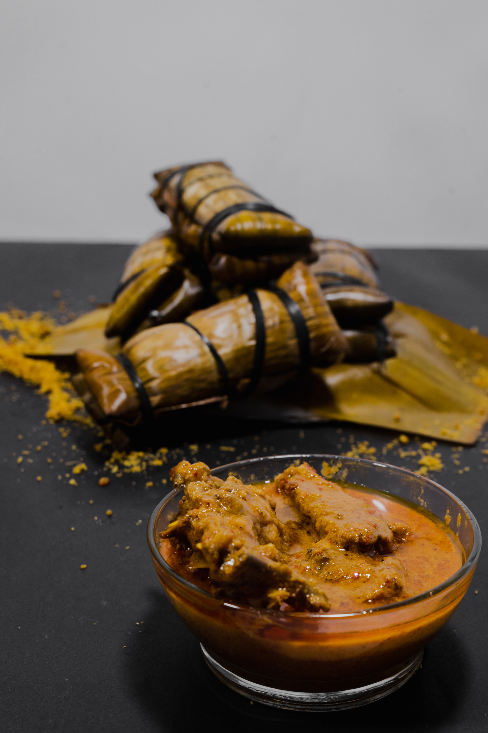 Overhead flat-lay of all ingredients for Ethiopian Honey-Scented Doro Kurma with Turmeric and Cardamom laid out on a kitchen surface.
