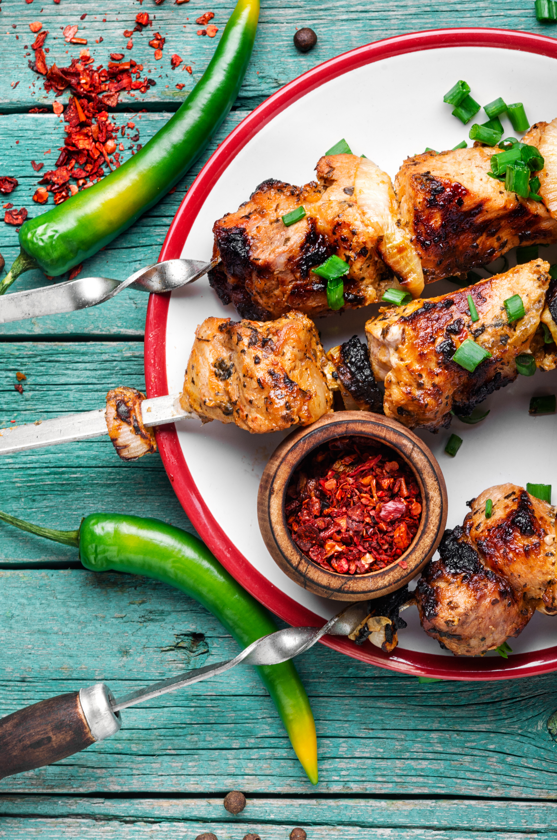 Overhead flat-lay of all ingredients for Ethiopian Spice-Rubbed Grilled Chicken with Injera Slices laid out on a kitchen surface.