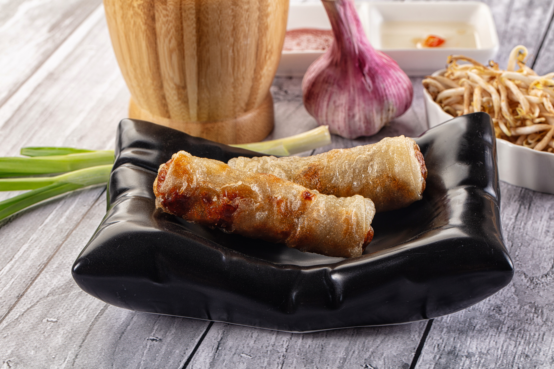 Overhead flat-lay of all ingredients for Exotic Filipino Lumpia with Sweet Soy Garlic Sauce laid out on a kitchen surface.