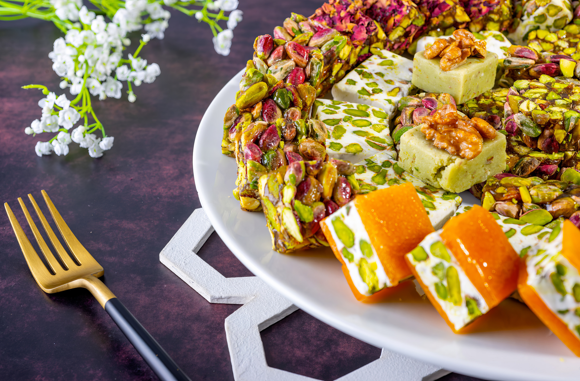 Overhead flat-lay of all ingredients for Exotic Iranian Saffron Halva with Pistachio Fragments laid out on a kitchen surface.