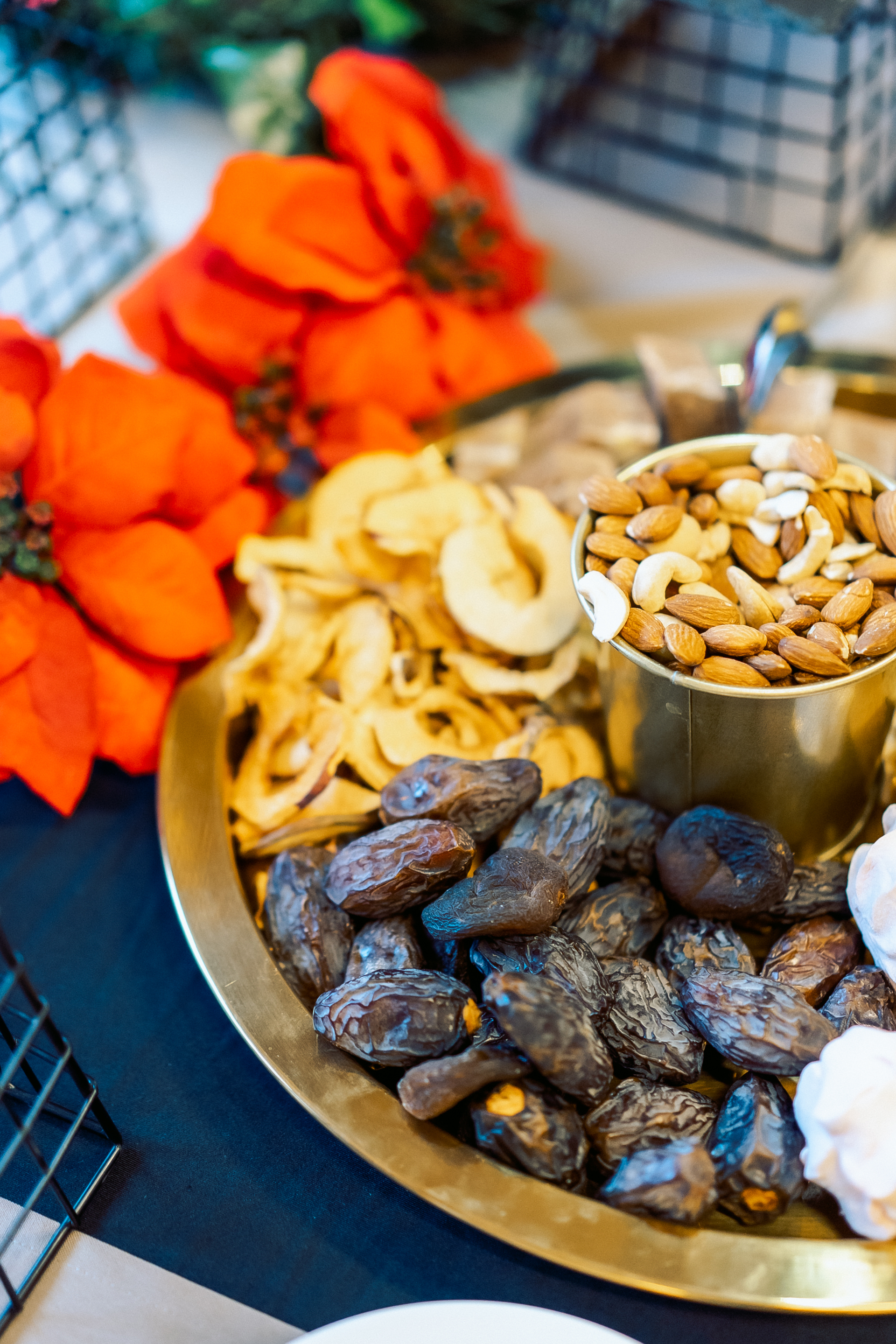 Overhead flat-lay of all ingredients for Exotic Moroccan Date and Almond Tagine laid out on a kitchen surface.