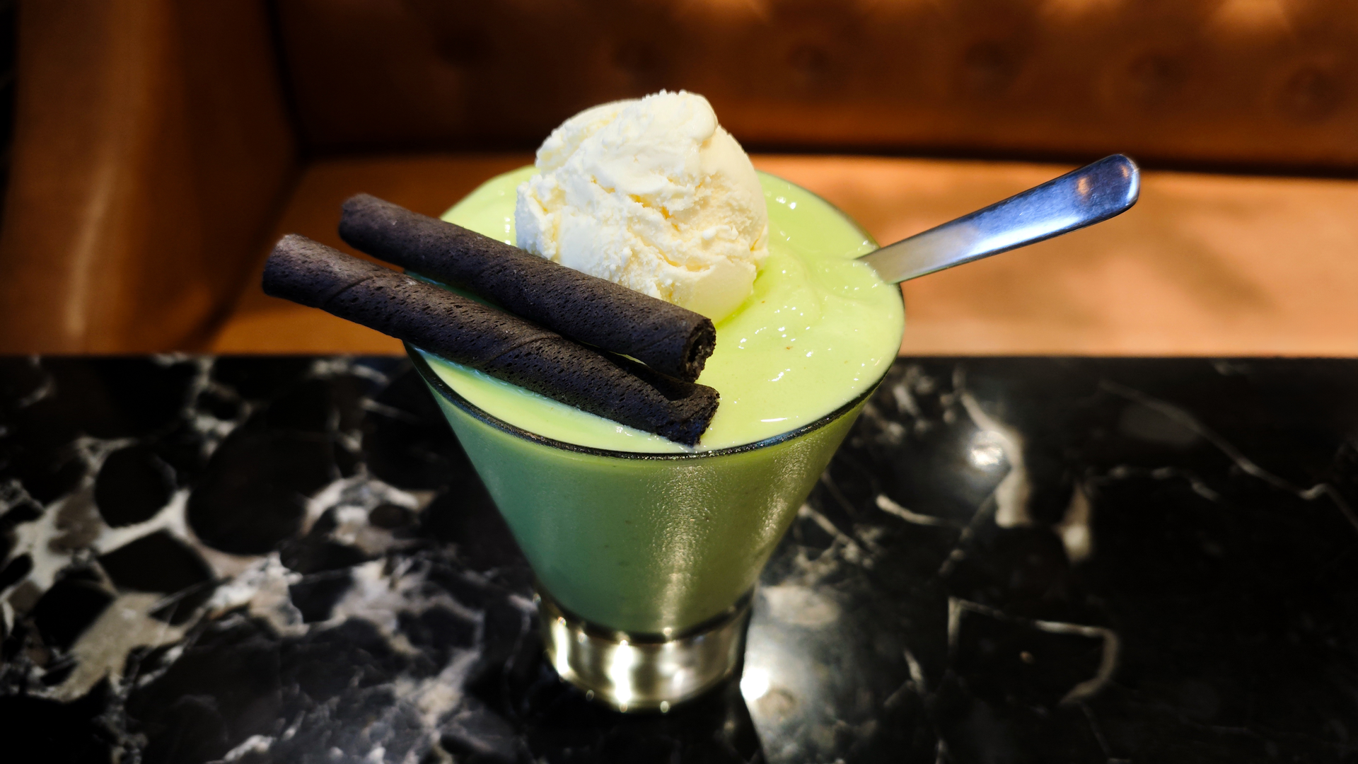 Overhead flat-lay of all ingredients for Exquisite Brazilian Feijoa Ice Cream with Balsamic Glaze laid out on a kitchen surface.
