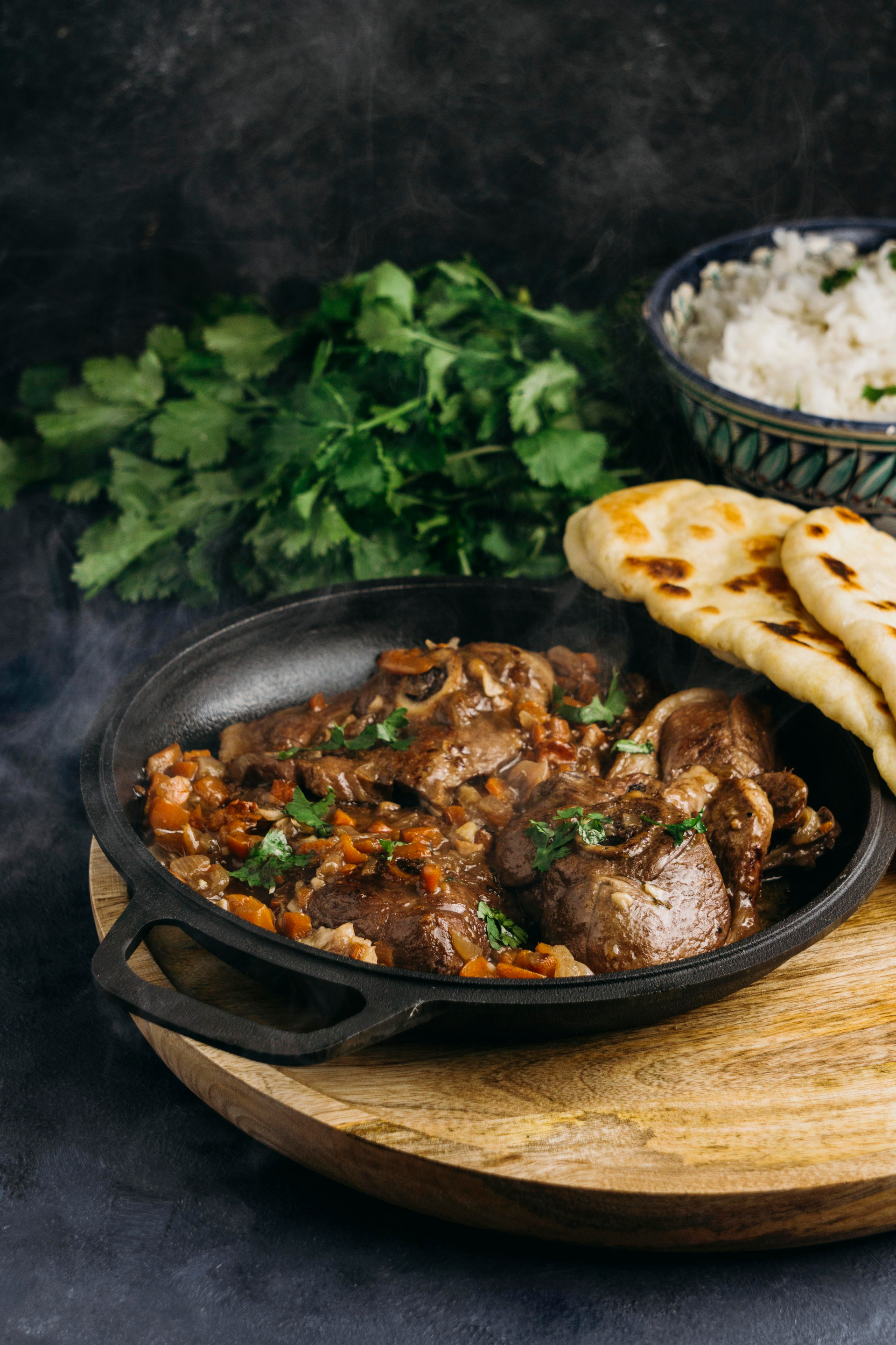 Overhead flat-lay of all ingredients for Fiery Ethiopian Awaze Beef Rolls laid out on a kitchen surface.