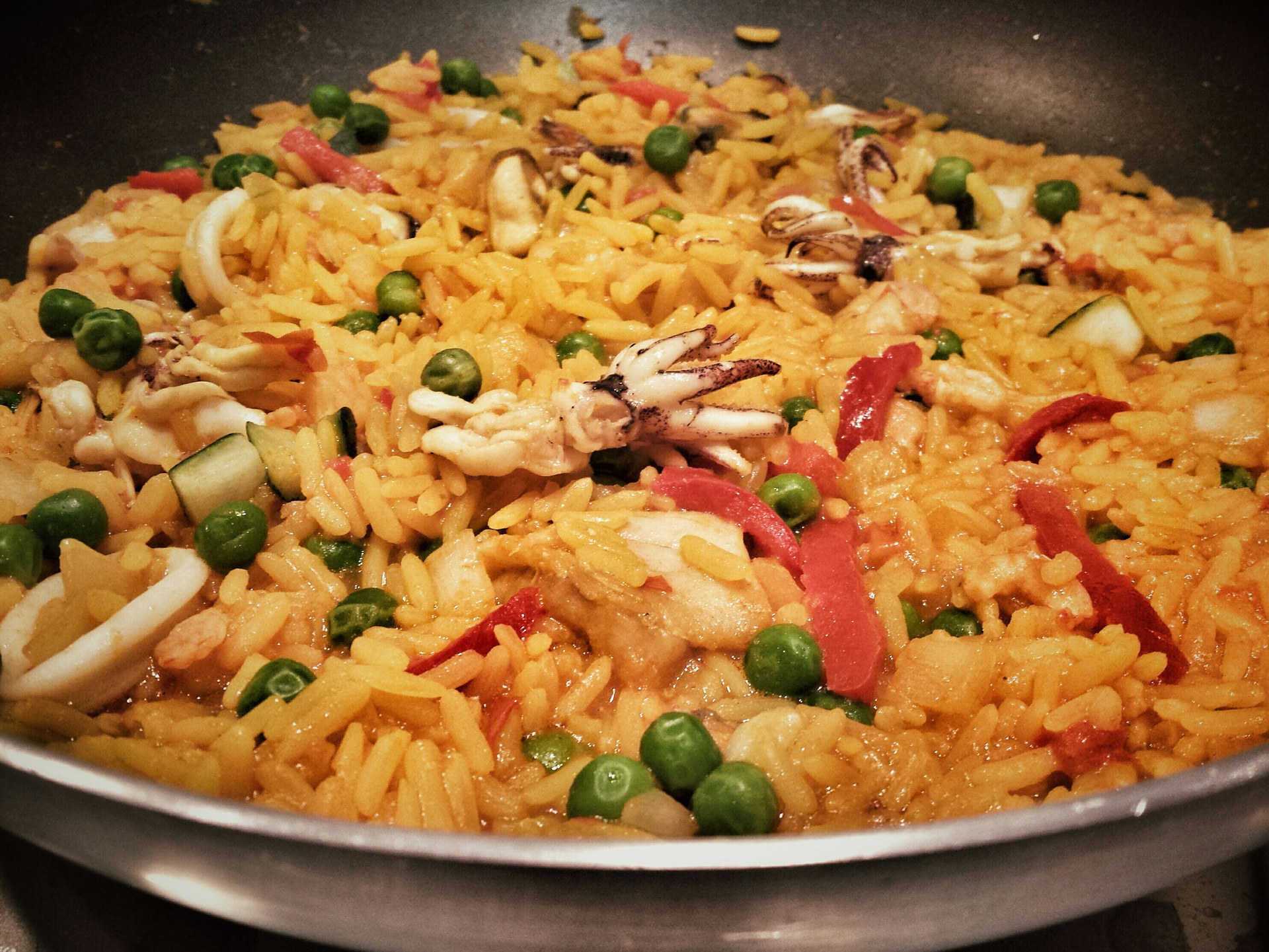 Overhead flat-lay of all ingredients for Fiery Peruvian Arroz Chaufa with Rocoto Chili Sauce laid out on a kitchen surface.