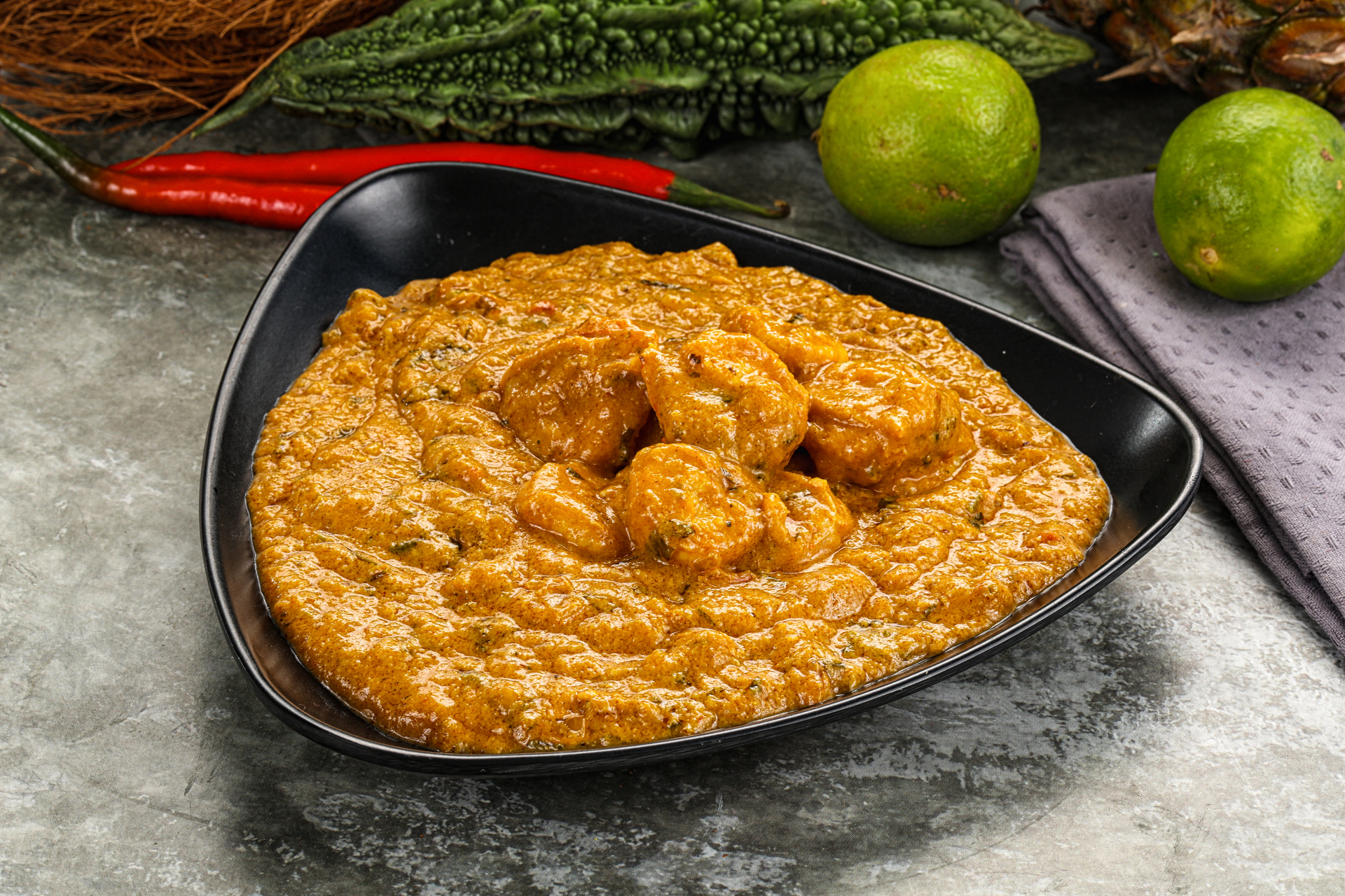 Overhead flat-lay of all ingredients for Fiery Trinidadian Fried Shrimp Roti with Curry Chickpeas laid out on a kitchen surface.
