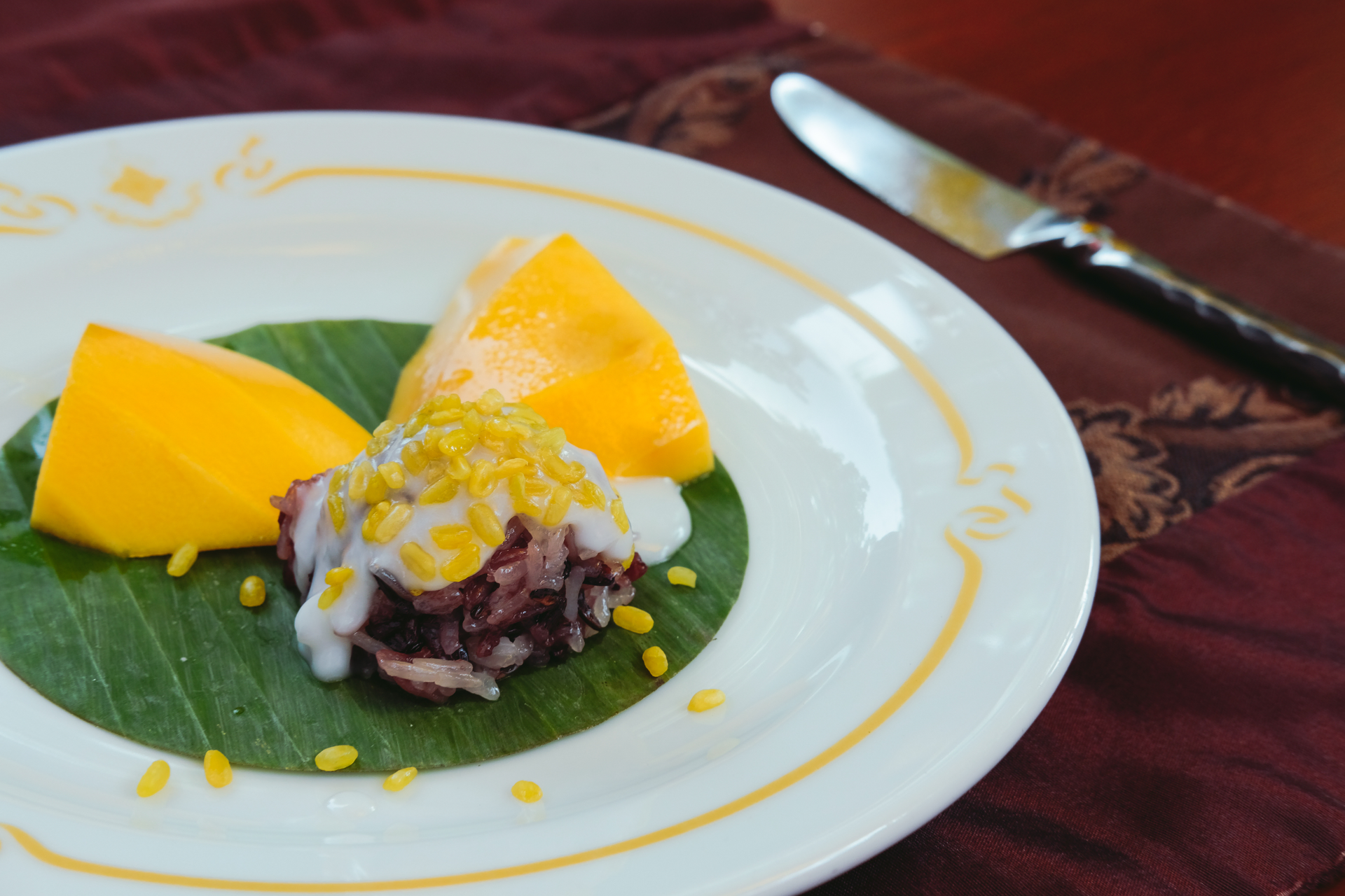 Overhead flat-lay of all ingredients for Filipino Calamansi-Coconut Dessert with Mango Salsa laid out on a kitchen surface.