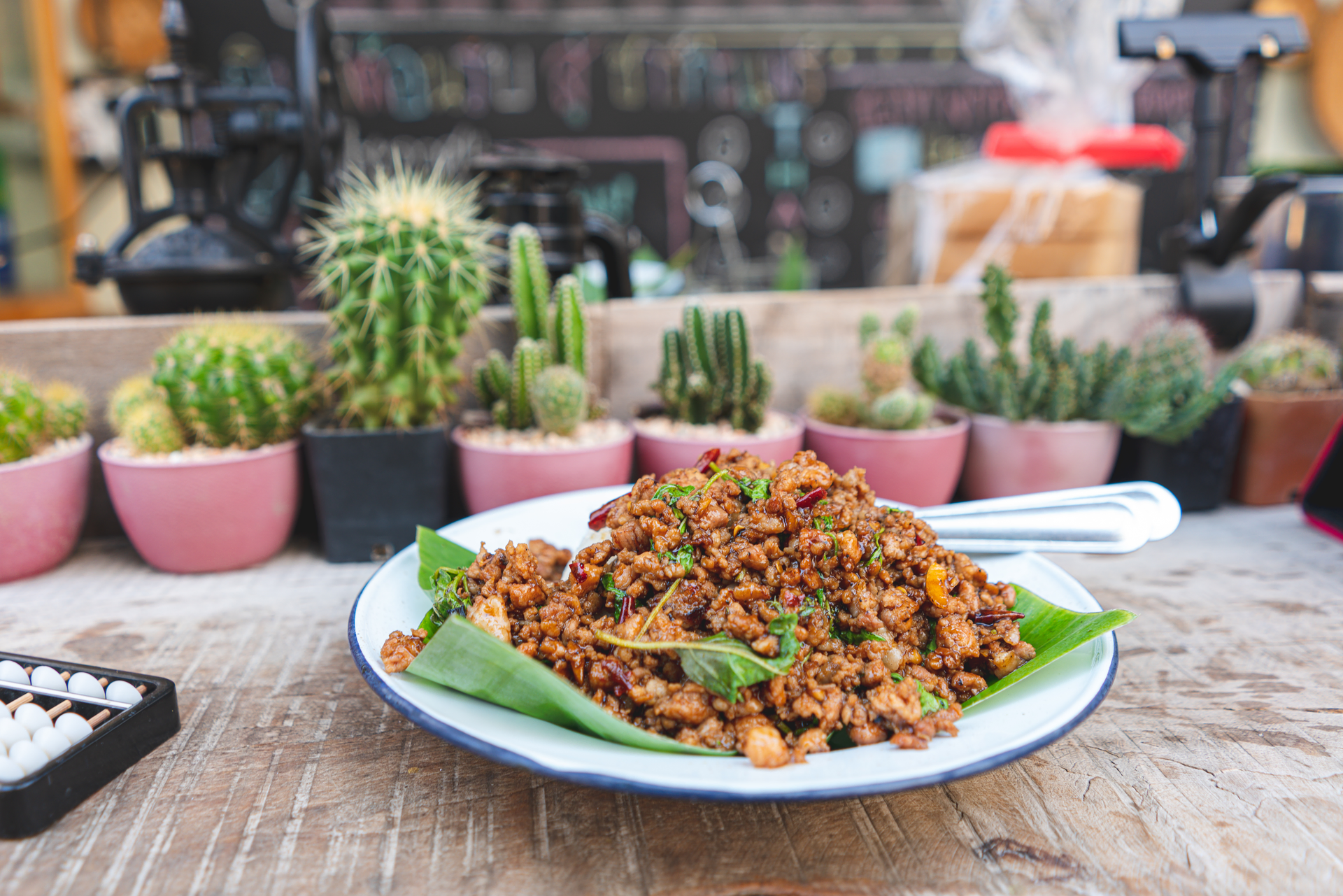 Overhead flat-lay of all ingredients for Filipino Grilled Pork Sisig with Calamansi and Chilies laid out on a kitchen surface.