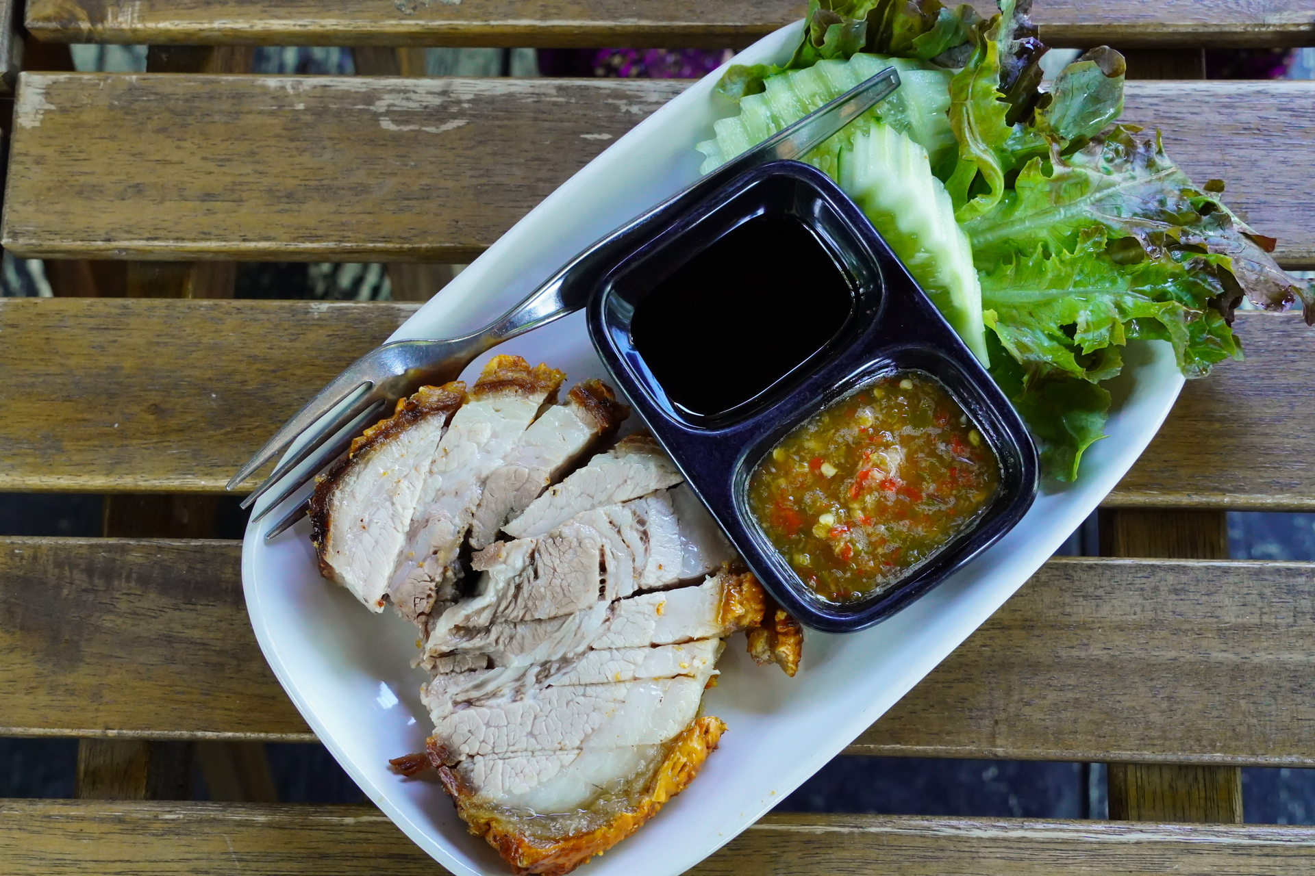 Overhead flat-lay of all ingredients for Filipino Lechon Kawali with Vinegar Dipping Sauce laid out on a kitchen surface.