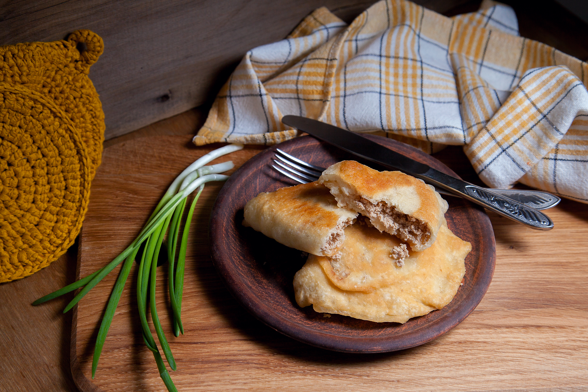 Overhead flat-lay of all ingredients for Finnic Karelian Pasties with Rice Porridge Filling laid out on a kitchen surface.