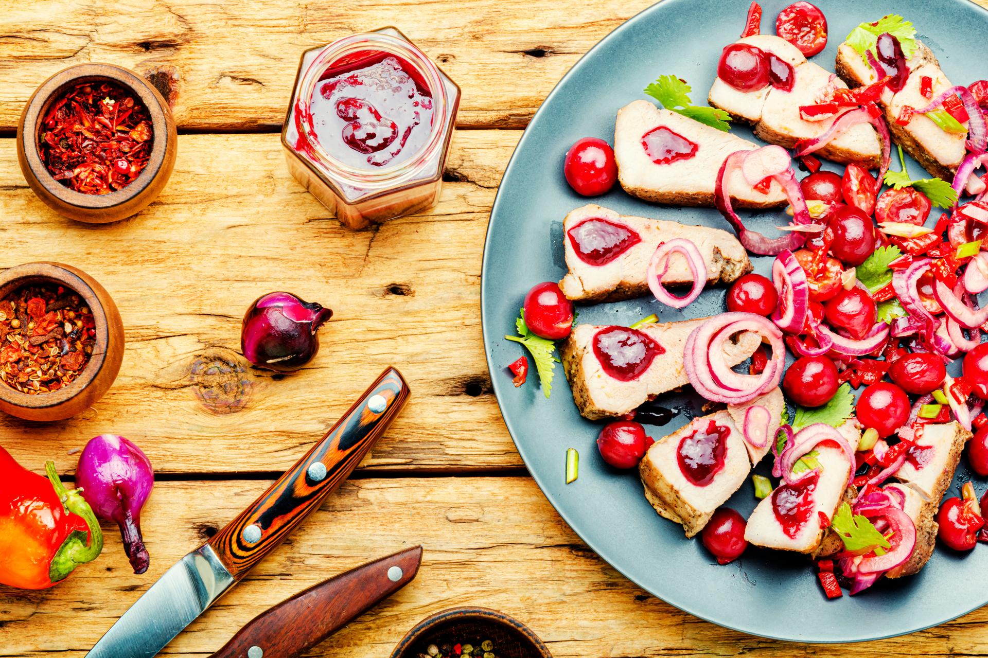 Overhead flat-lay of all ingredients for Finnish Lapaset with Smoked Sausage and Lingonberries laid out on a kitchen surface.