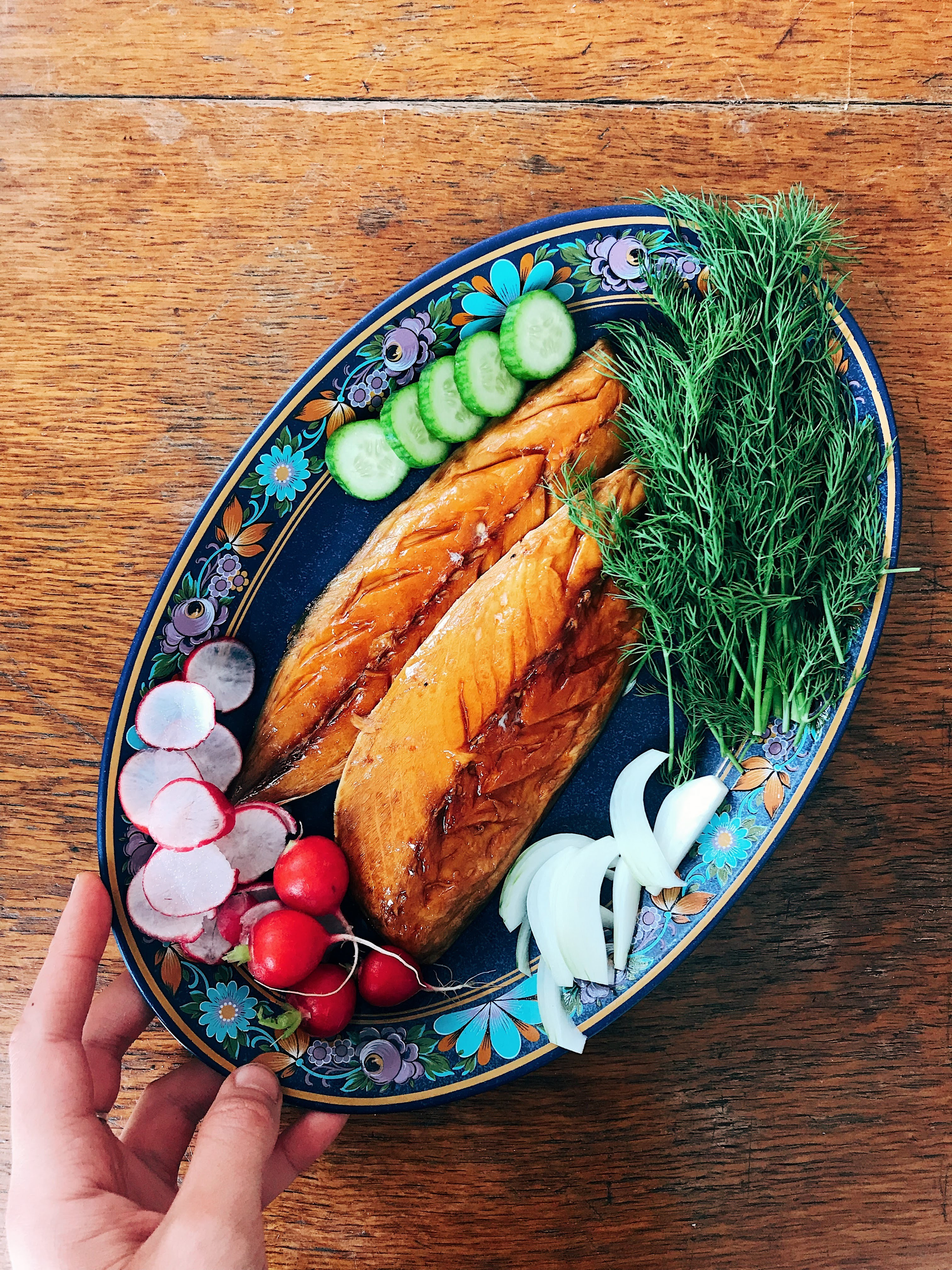 Overhead flat-lay of all ingredients for Finnish Salmon Cooked on Birch Wood with Mustard Dill Sauce laid out on a kitchen surface.