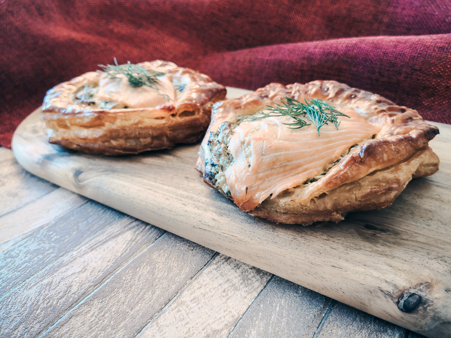 Overhead flat-lay of all ingredients for Finnish Salmon Karelian Pies with Dill Cream laid out on a kitchen surface.