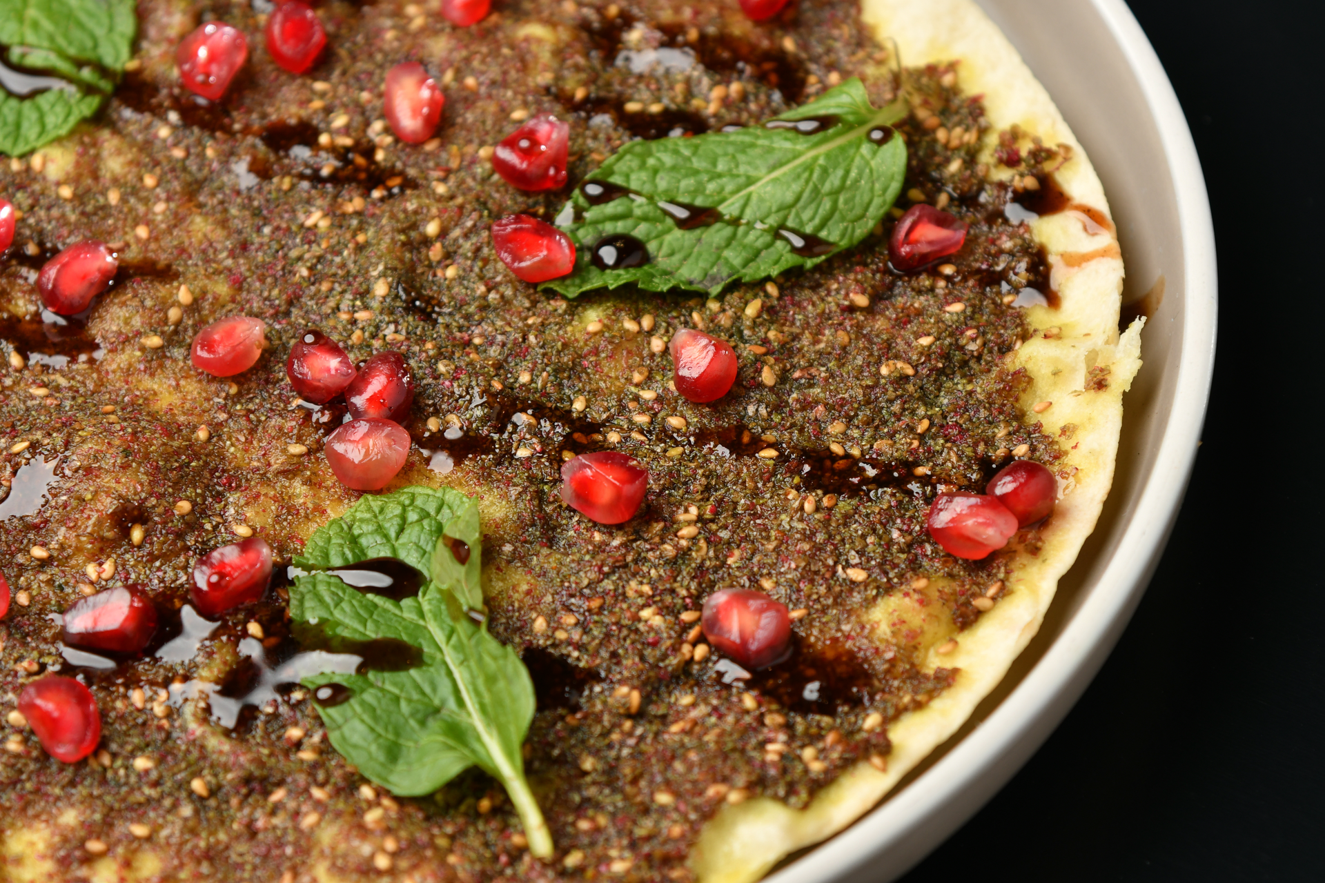 Flaky Lebanese Thyme Manakish with Sumac Onions — Appetizer served and photographed from above