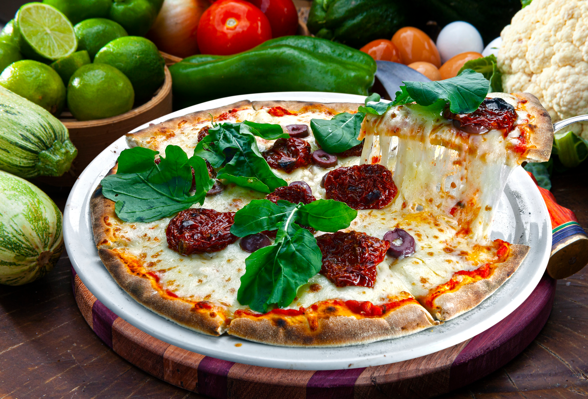 Overhead flat-lay of all ingredients for Flavorful Argentine Matambre a la Pizza with Mozzarella and Basil laid out on a kitchen surface.