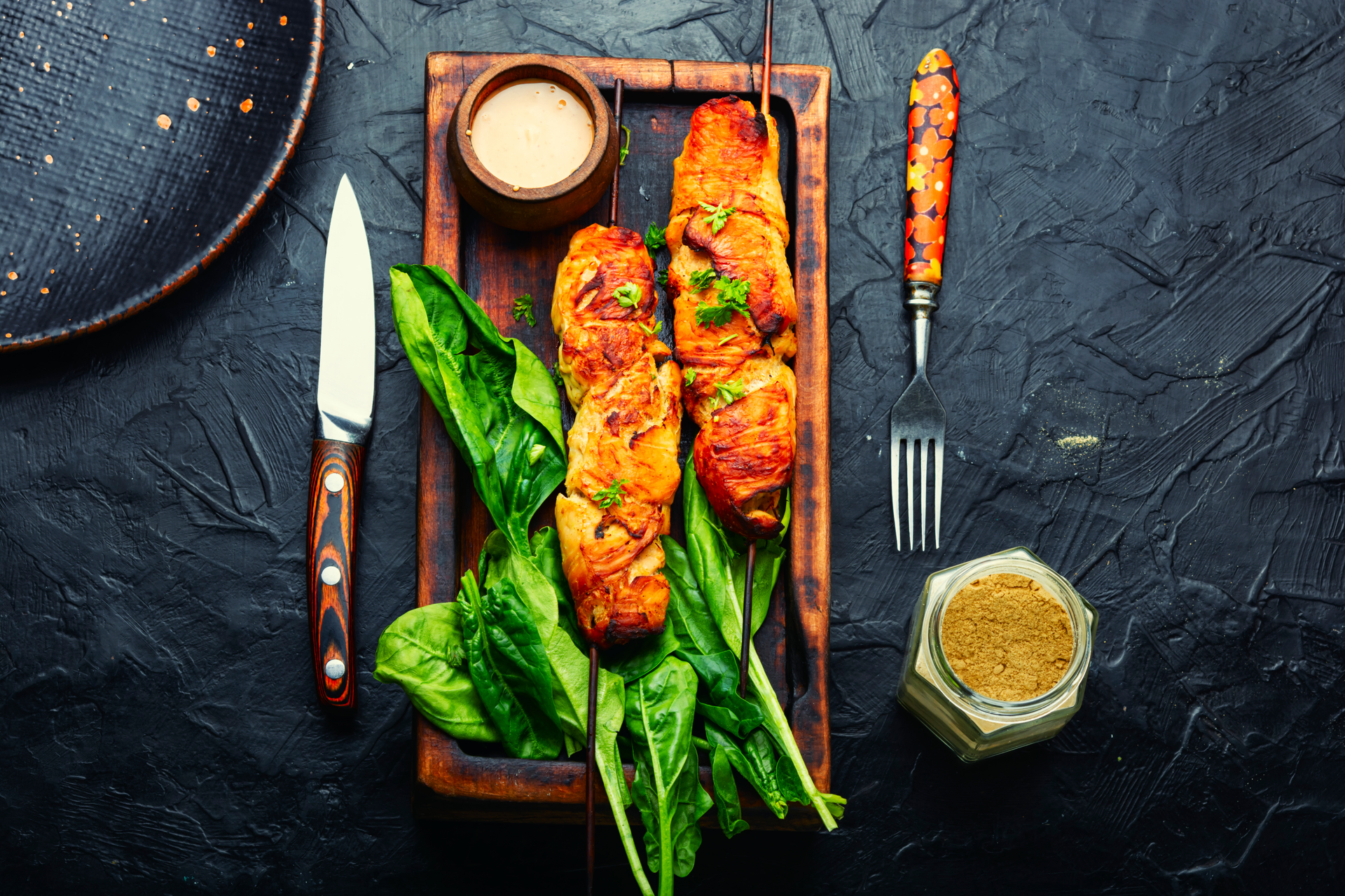 Overhead flat-lay of all ingredients for Flavorful Turkish Tavuk Sis with Sumac and Parsley Marinade laid out on a kitchen surface.