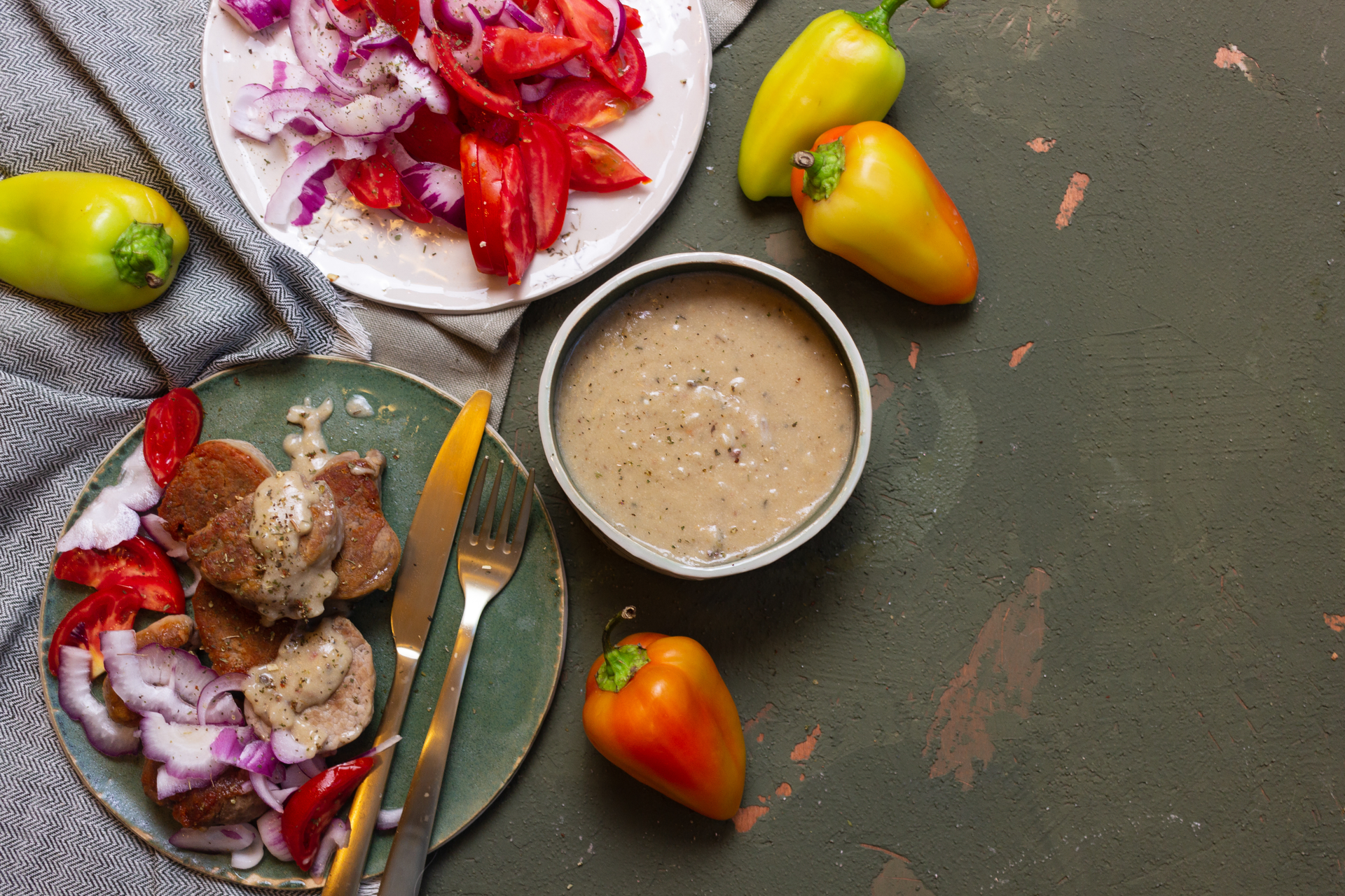 Overhead flat-lay of all ingredients for Flavorsome Ethiopian Firfir with Berbere Sauce and Injera laid out on a kitchen surface.