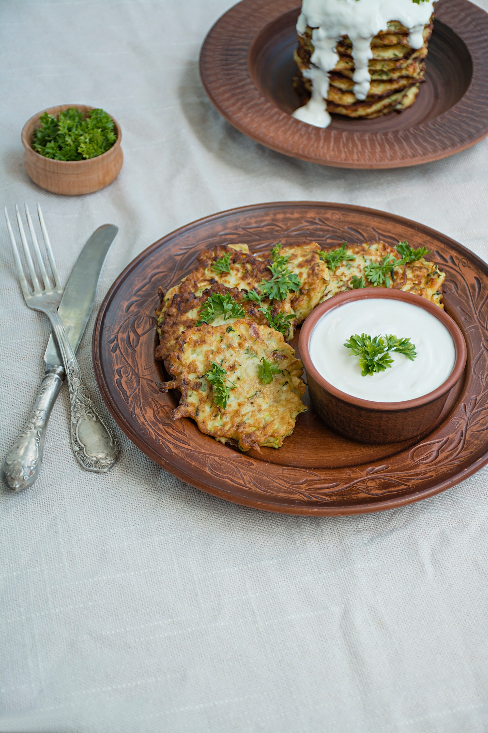 Overhead flat-lay of all ingredients for Flavorsome Ukrainian Deruny with Sour Cream and Dill laid out on a kitchen surface.