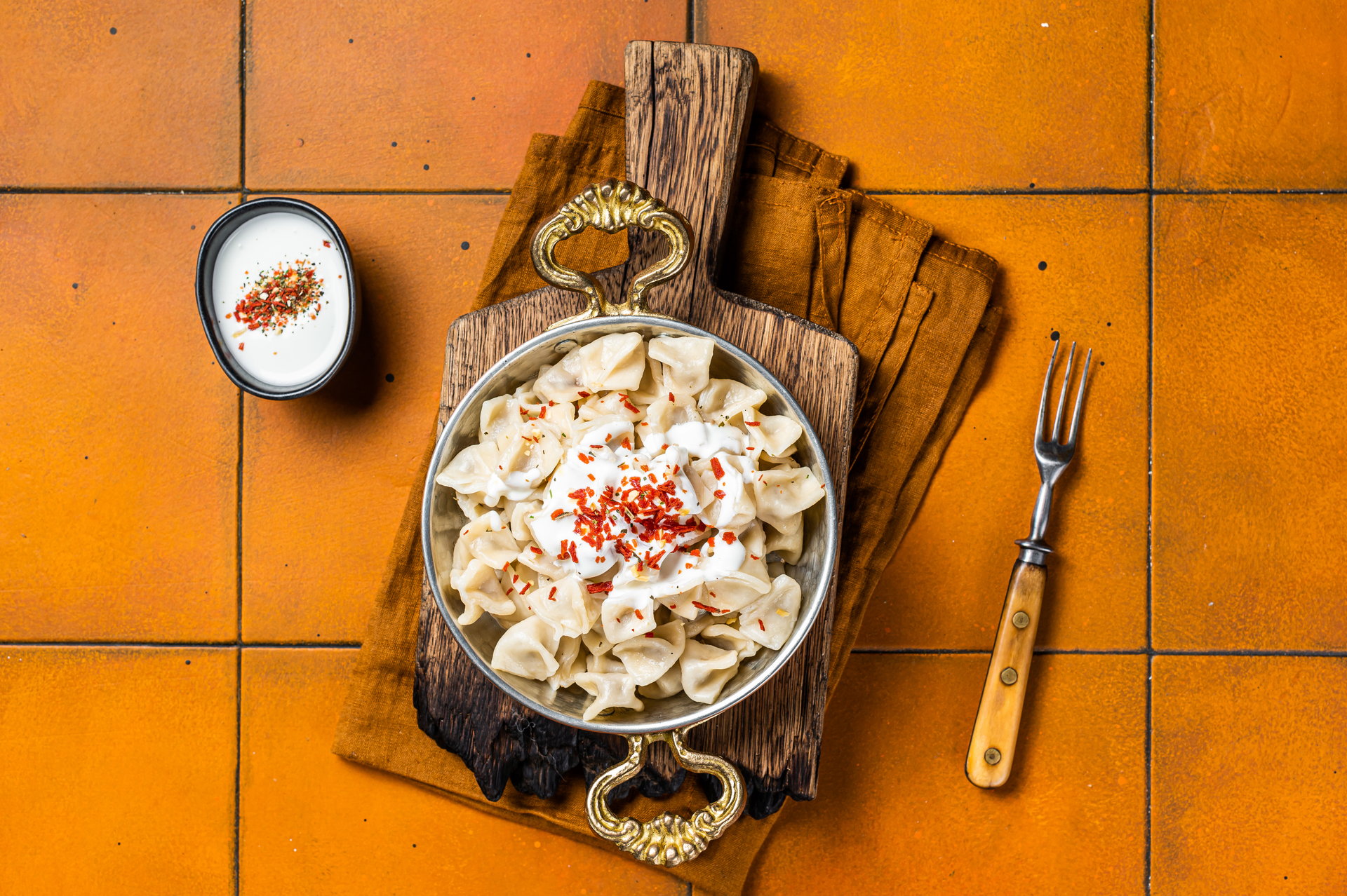 Overhead flat-lay of all ingredients for Flavorsome Uzbek Manty laid out on a kitchen surface.