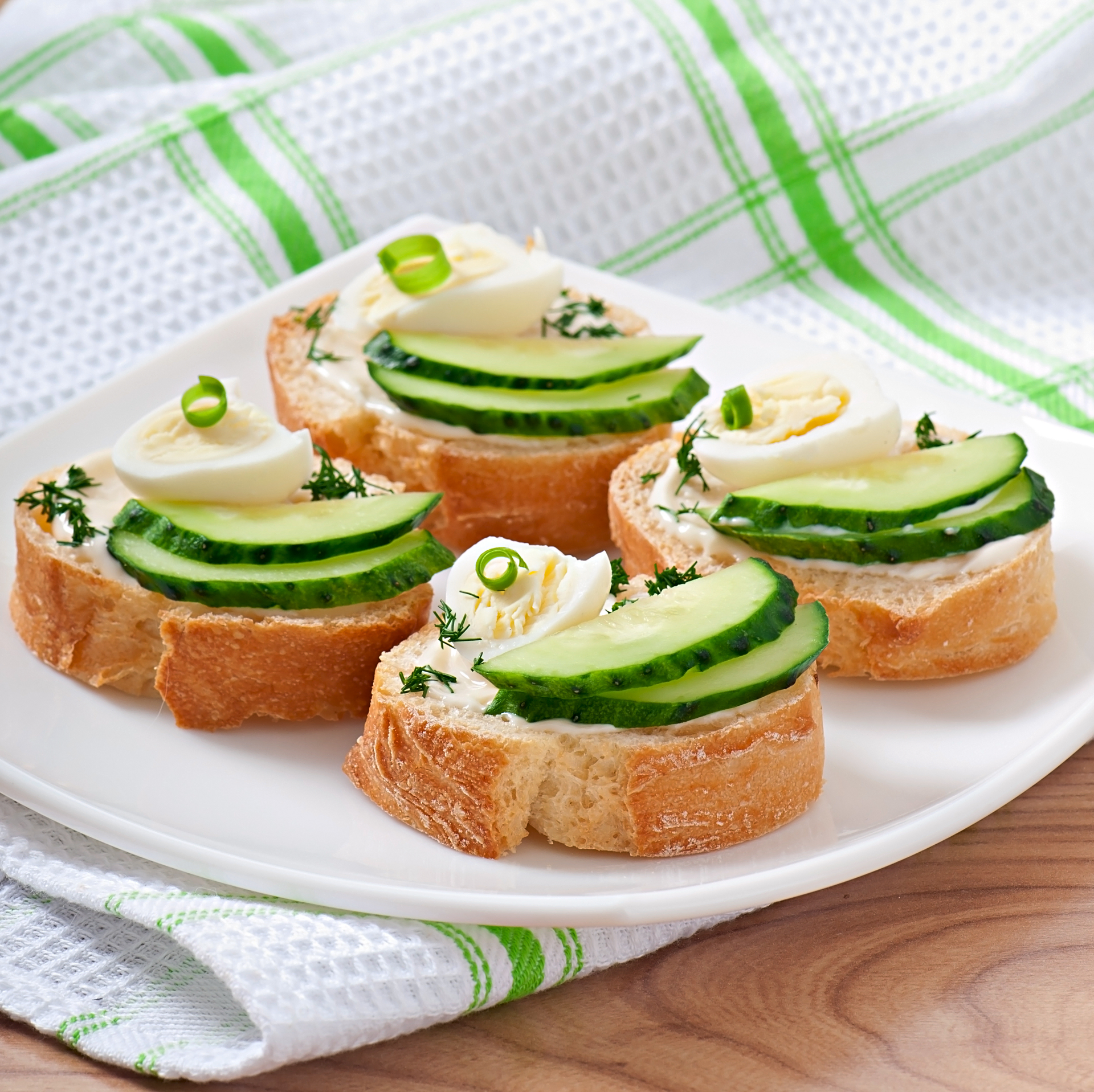 Fluffy British Cucumber Sandwiches with Herbed Cream Cheese — Snack served and photographed from above