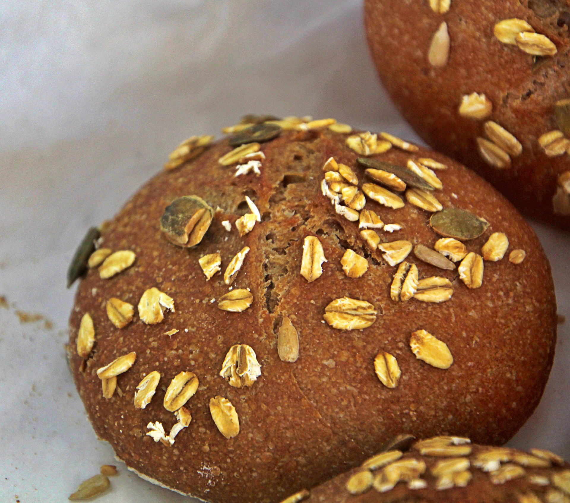 Overhead flat-lay of all ingredients for Fluffy Danish Rye Bread with Sunflower Seeds laid out on a kitchen surface.