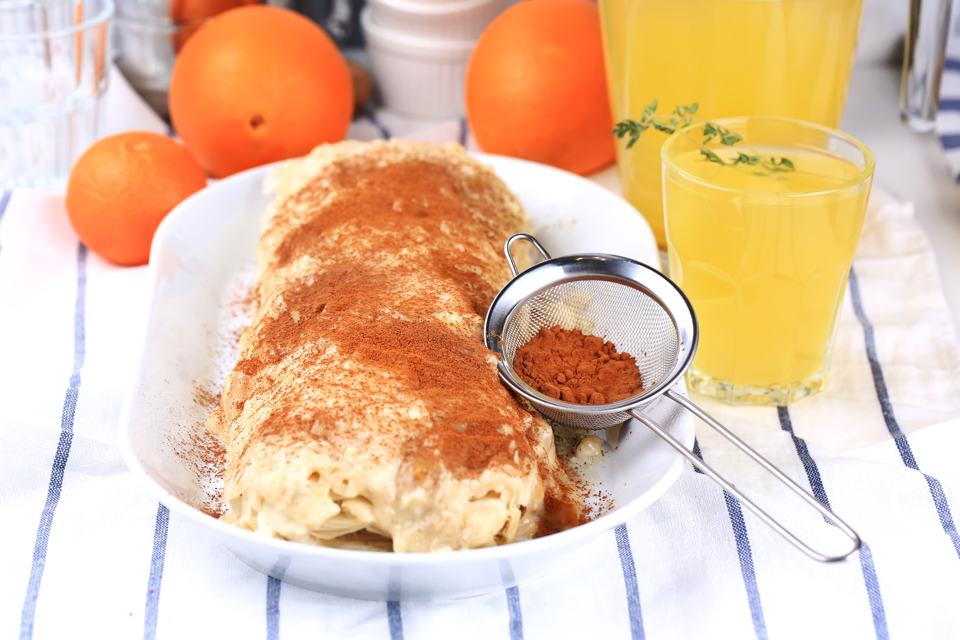 Overhead flat-lay of all ingredients for Fluffy Greek Bougatsa with Cinnamon and Orange Zest laid out on a kitchen surface.