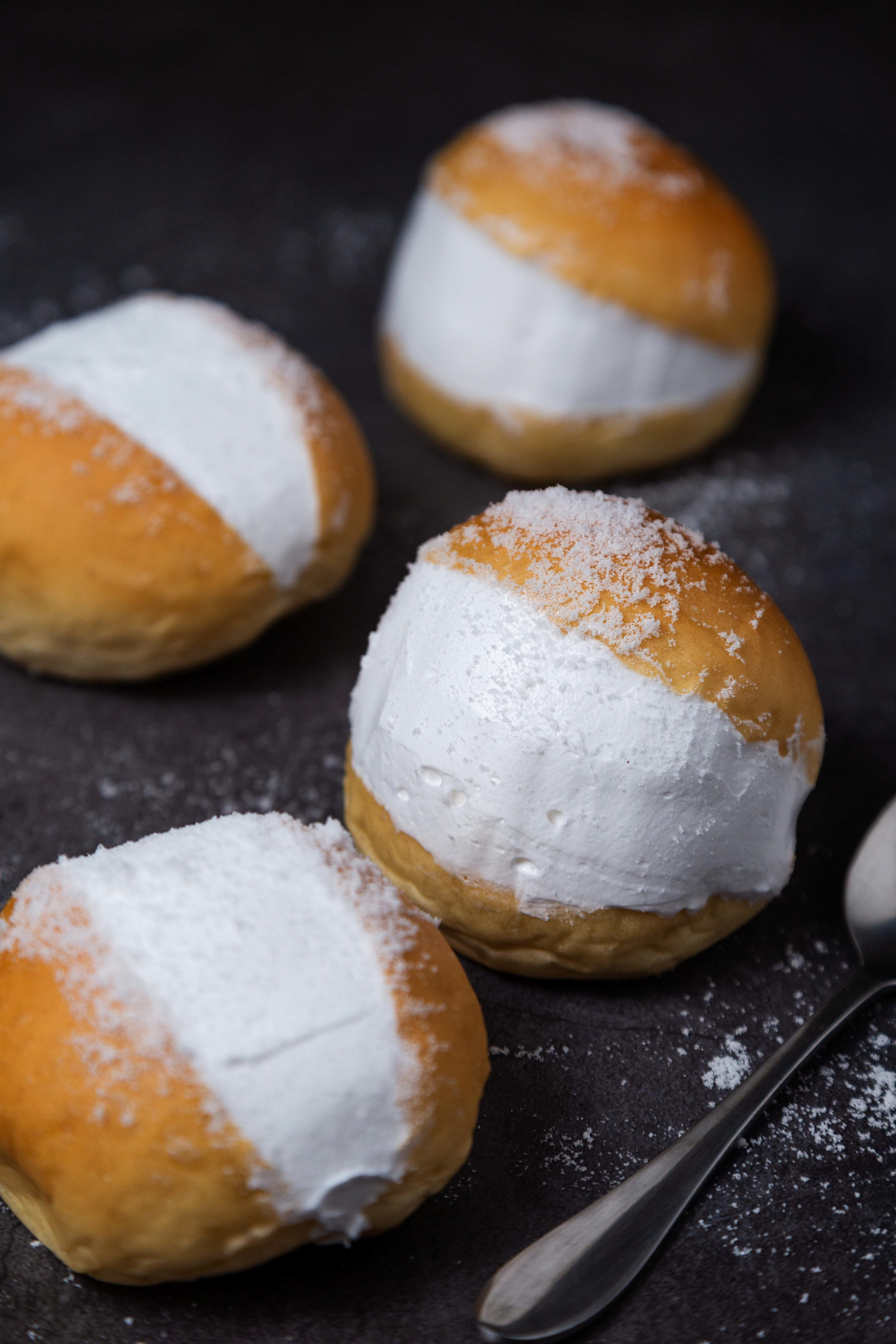 Overhead flat-lay of all ingredients for Fluffy Italian Maritozzi Buns with Whipped Ricotta laid out on a kitchen surface.