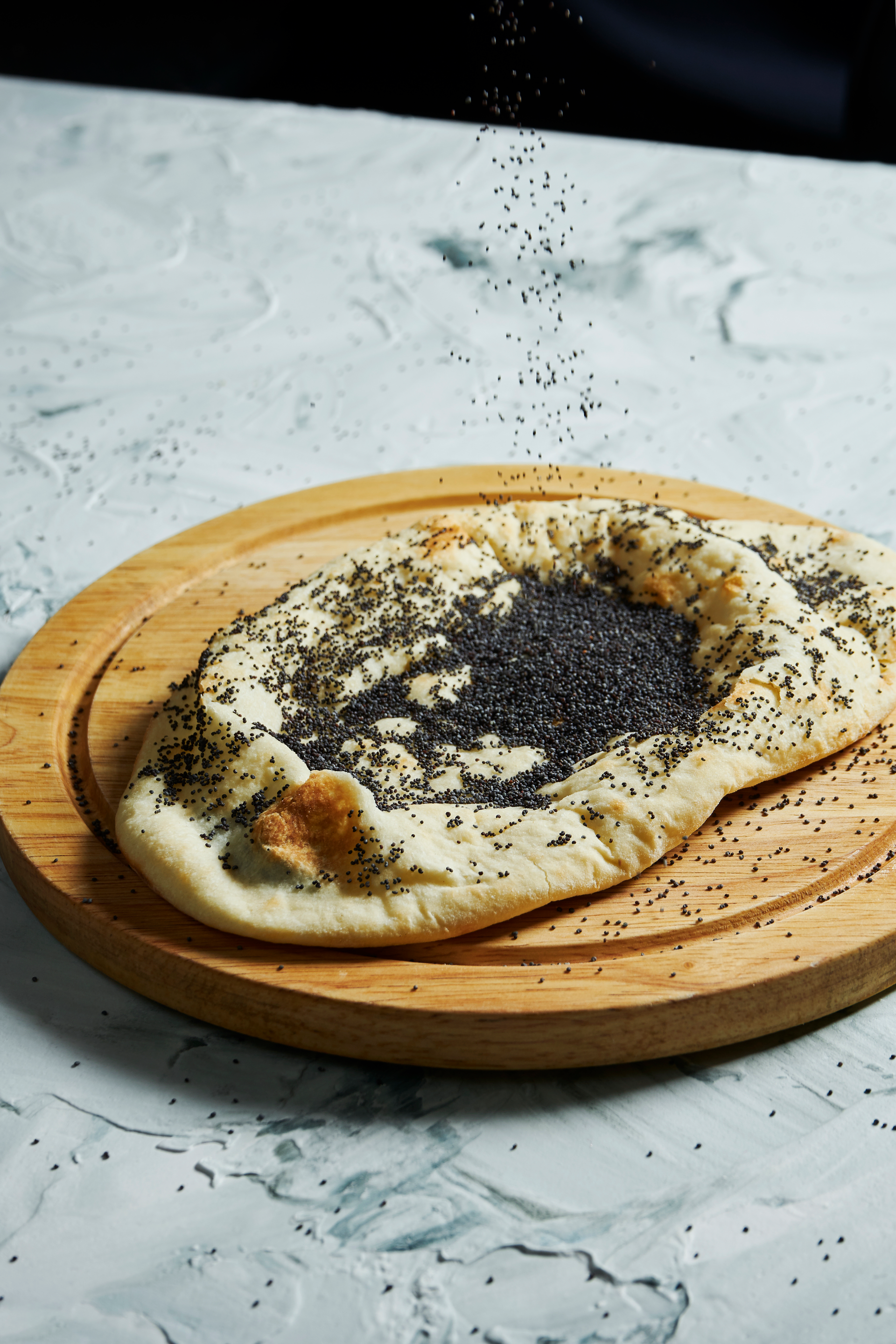 Fluffy Yemeni Malawah with Black Seed — Snack served and photographed from above