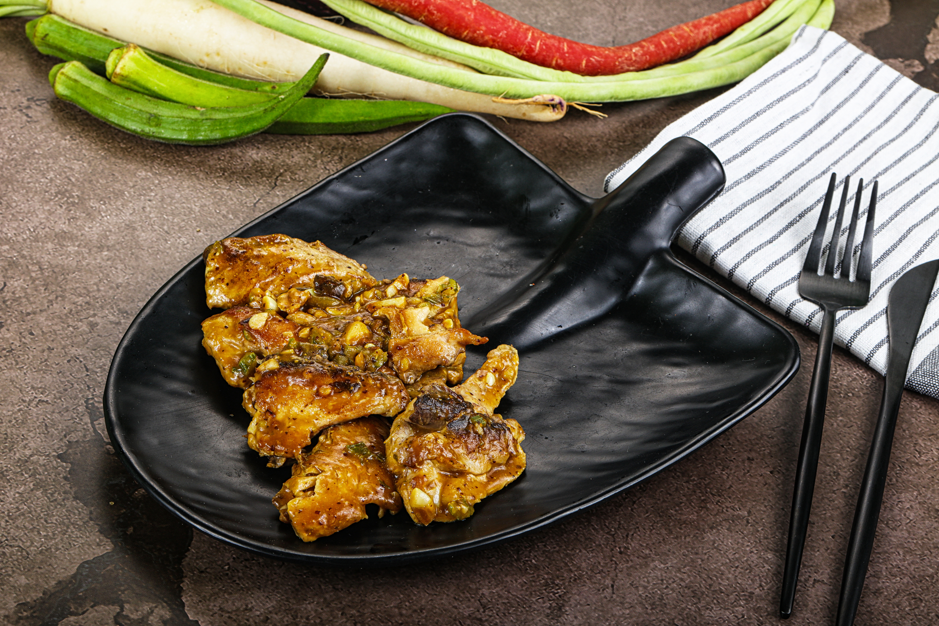 Overhead flat-lay of all ingredients for Fragrant Balinese Ayam Betutu laid out on a kitchen surface.