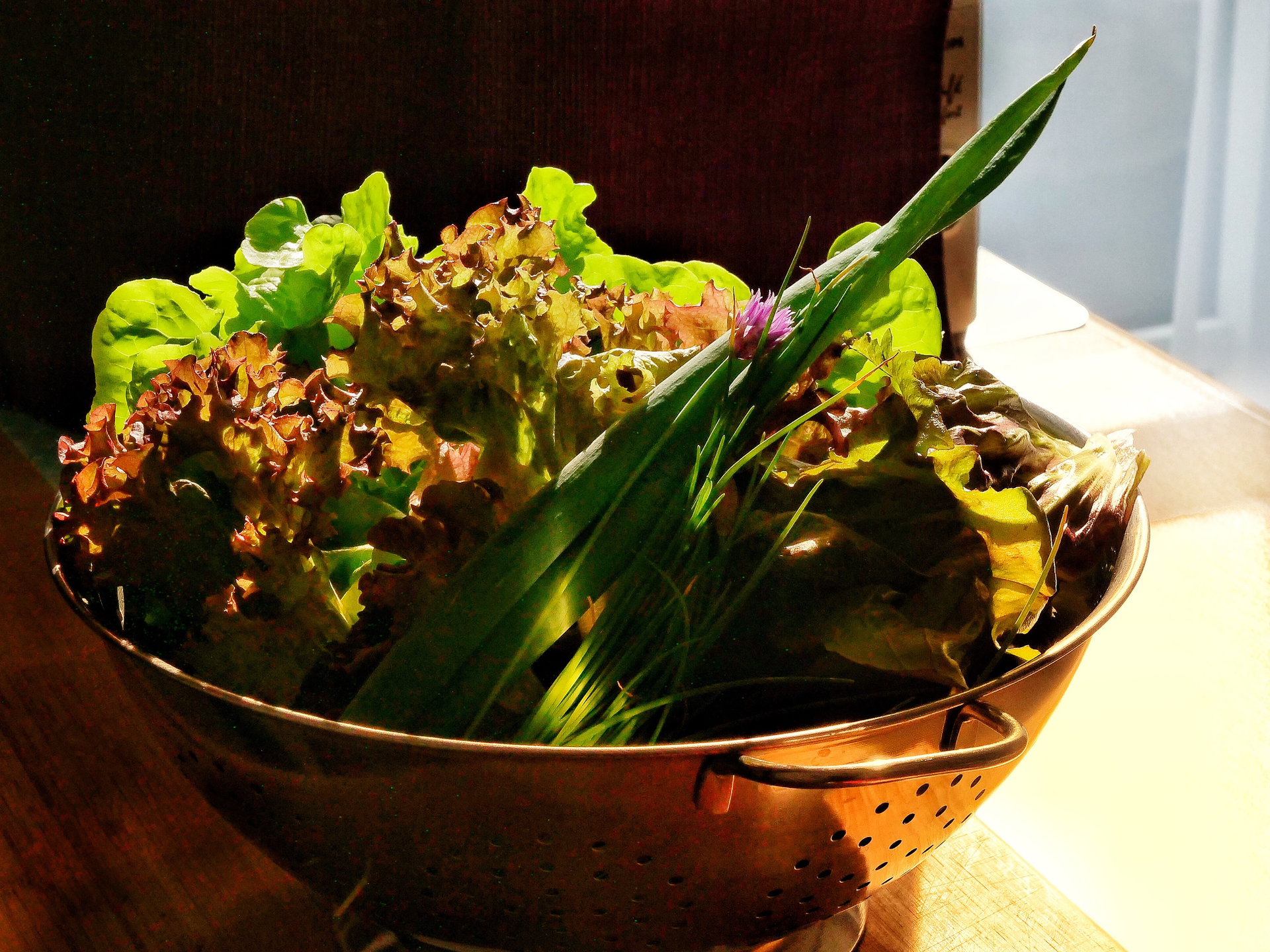Overhead flat-lay of all ingredients for Fragrant Balinese Lawar with Kaffir Lime and Vegetables laid out on a kitchen surface.