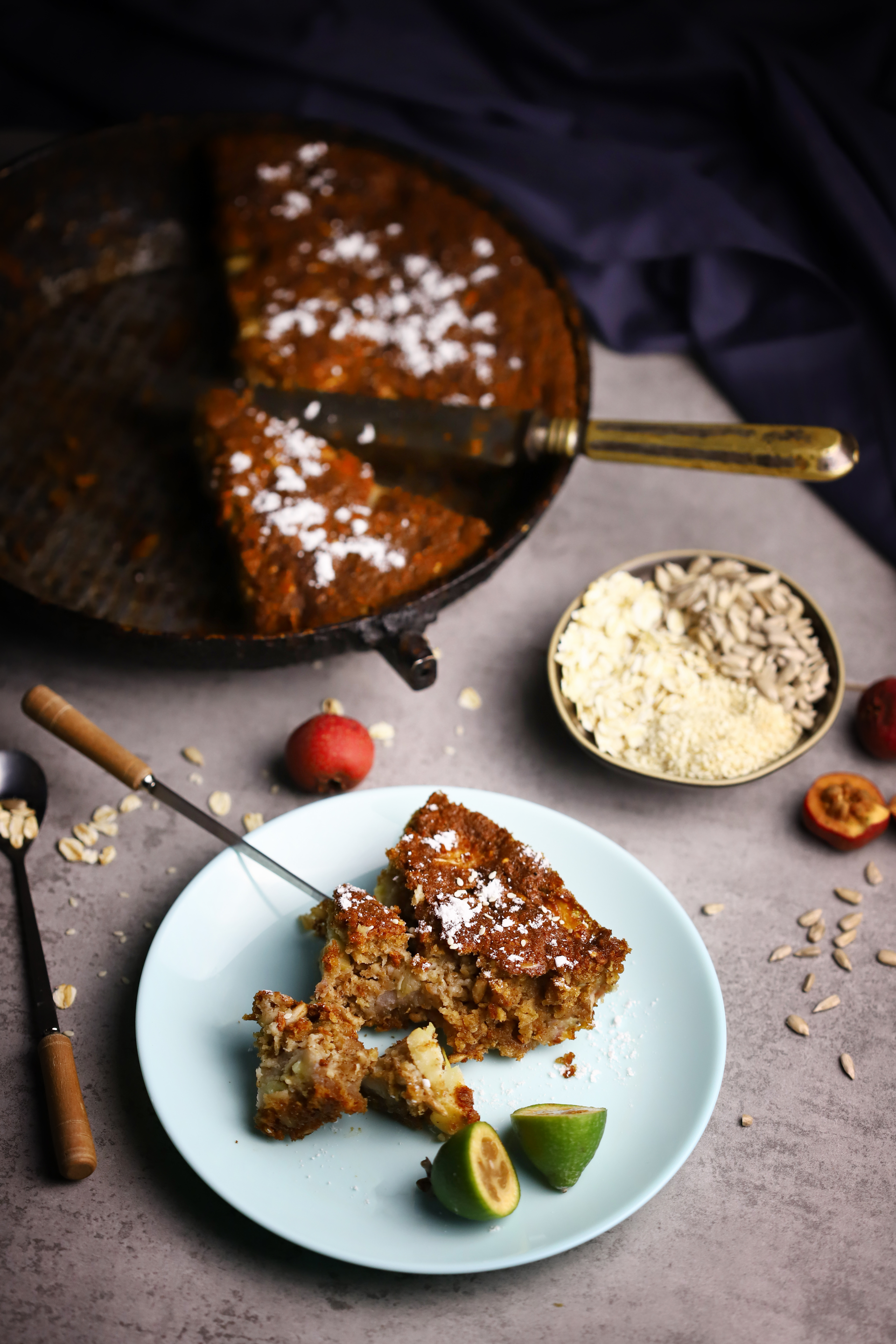 Overhead flat-lay of all ingredients for Fragrant Ethiopian Spiced Honey Cake with Teff Flour laid out on a kitchen surface.