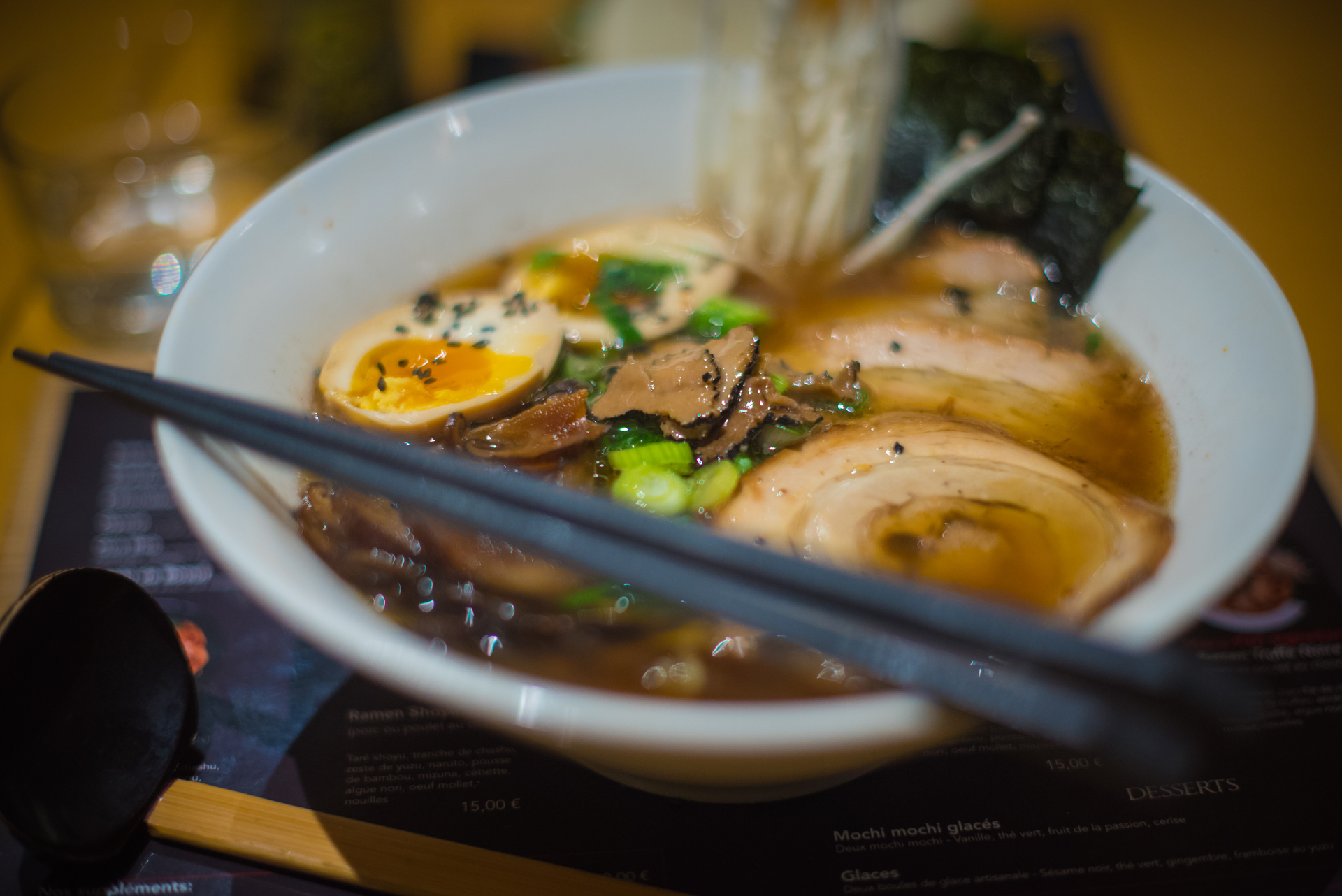 Overhead flat-lay of all ingredients for Fragrant Japanese Niboshi Ramen with Clam Broth laid out on a kitchen surface.