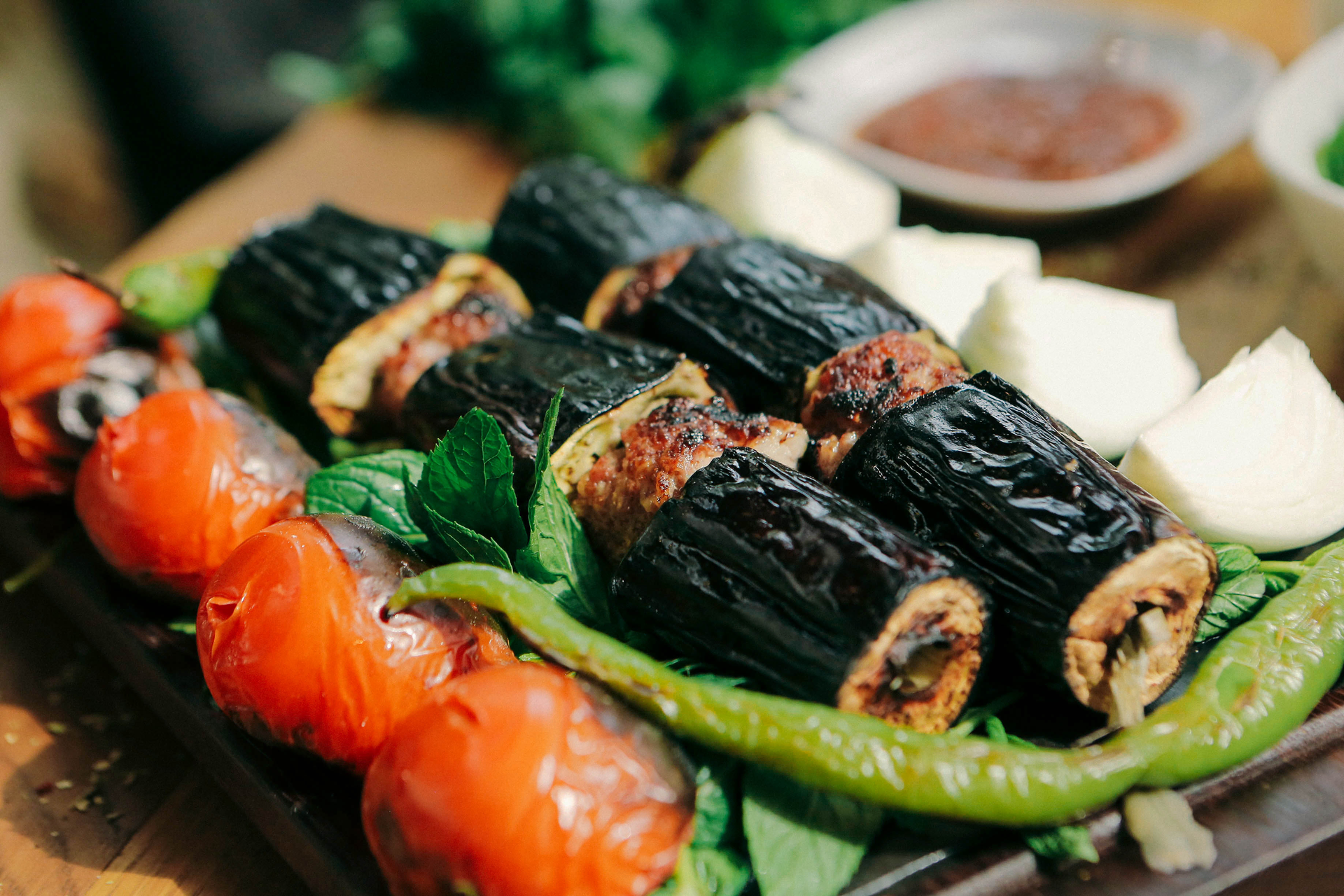 Fragrant Lebanese Sumac-Dusted Grilled Eggplant Rolls with Goat Cheese — Appetizer served and photographed from above