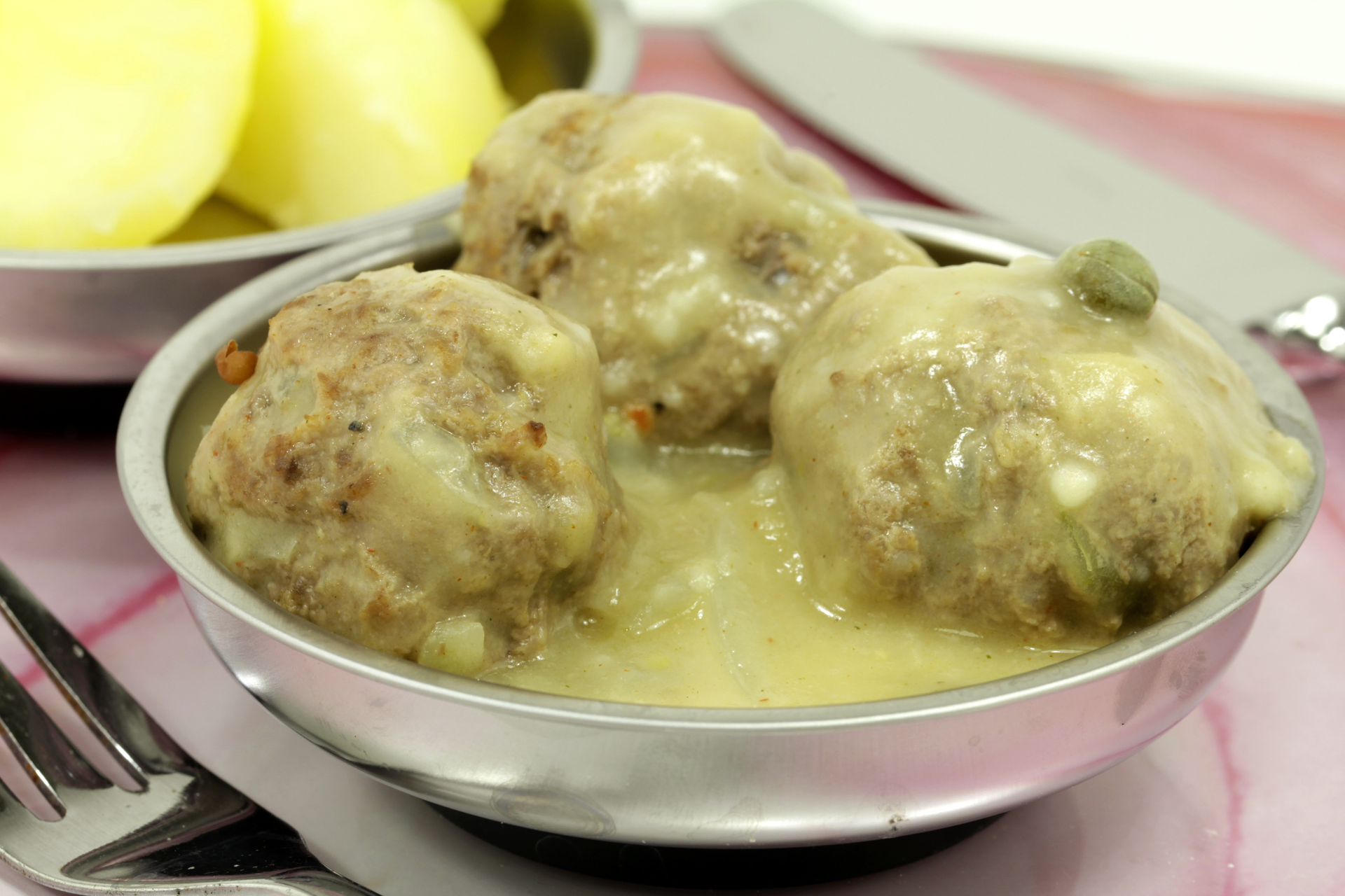 Fragrant Mauritian Boulettes with Chayote and Garlic Sauce — Main Course served and photographed from above