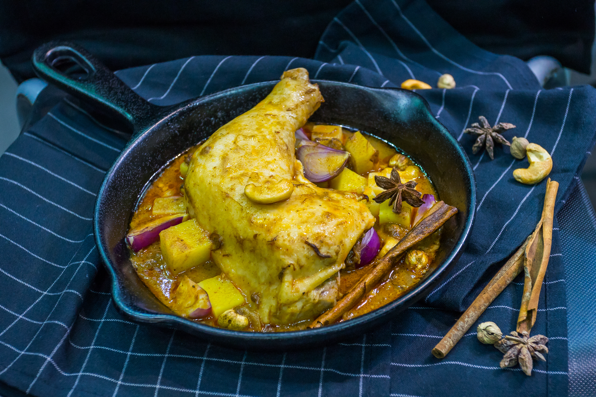 Overhead flat-lay of all ingredients for Fragrant Moroccan Chicken M'hammar with Saffron laid out on a kitchen surface.