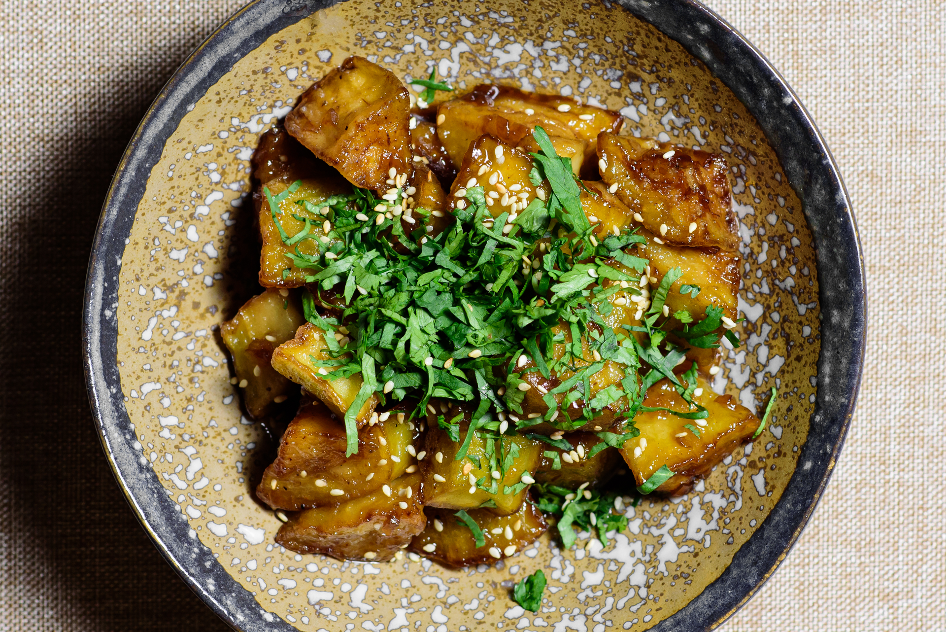 Overhead flat-lay of all ingredients for Fragrant Sri Lankan Eggplant Moju with Tamarind and Ginger laid out on a kitchen surface.