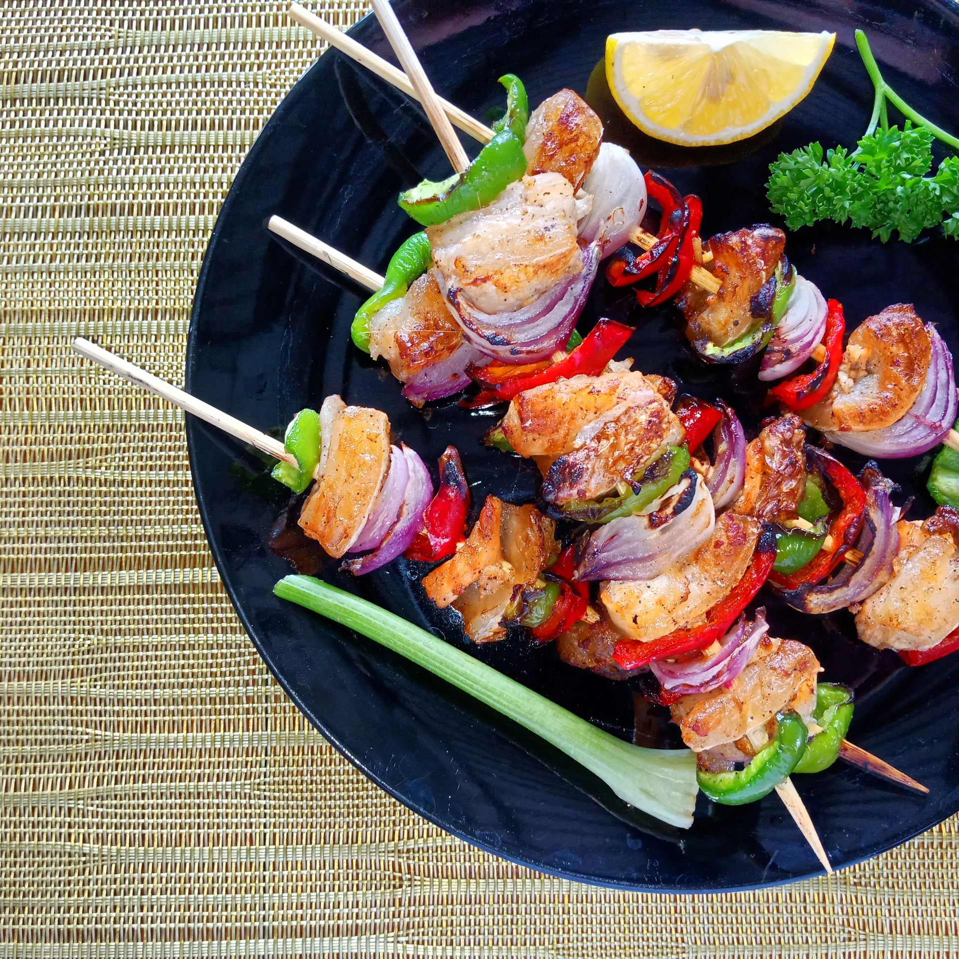 Overhead flat-lay of all ingredients for Fragrant Thai Lemongrass Shrimp Skewers laid out on a kitchen surface.