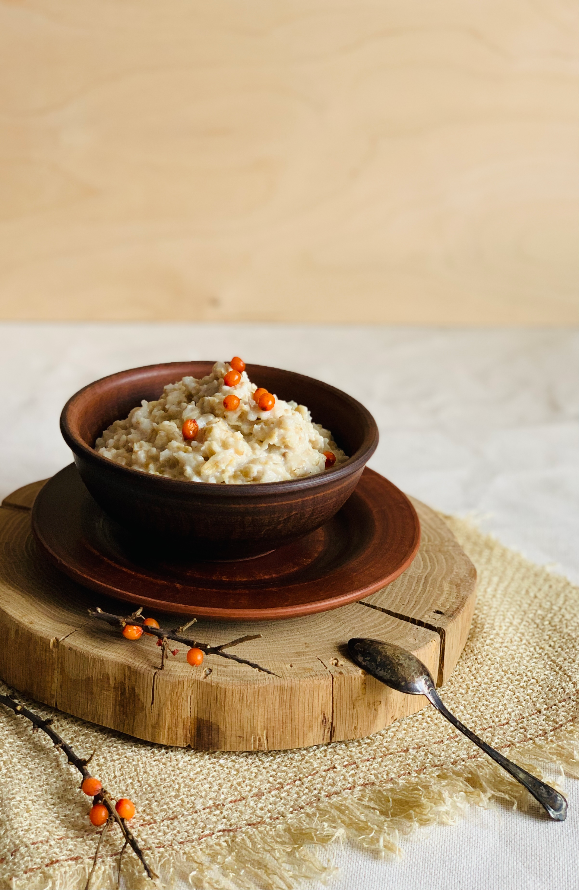 Overhead flat-lay of all ingredients for Fragrant Tibetan Tsampa Porridge with Roasted Barley laid out on a kitchen surface.
