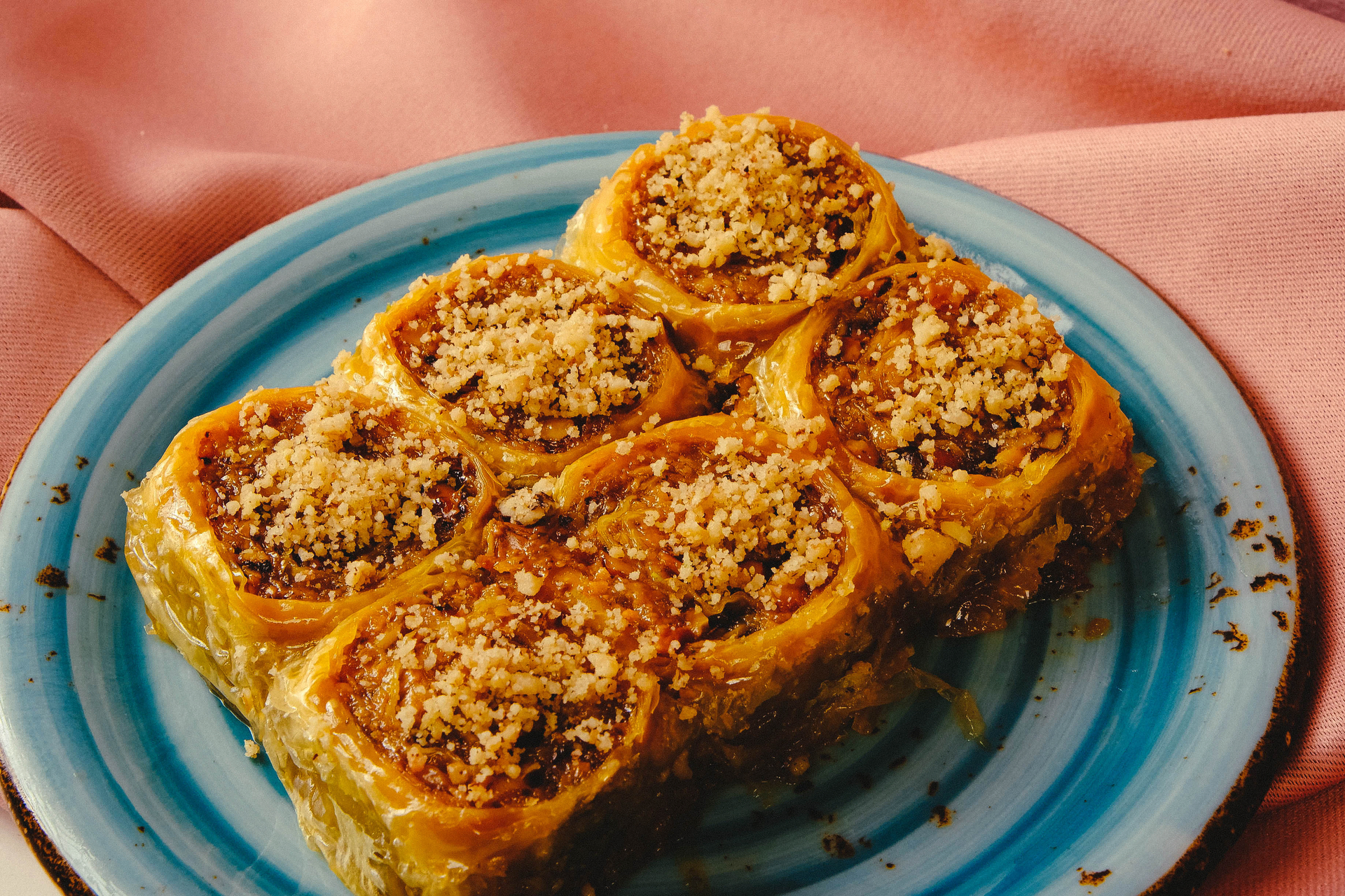 Overhead flat-lay of all ingredients for Fragrant Tunisian Baklawa with Almond and Rosewater laid out on a kitchen surface.