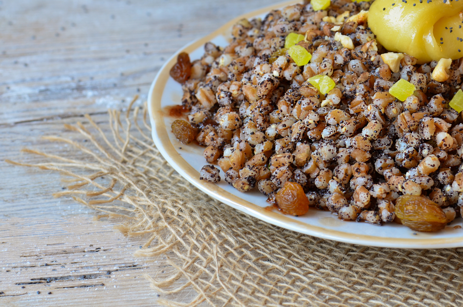 Overhead flat-lay of all ingredients for Fragrant Tunisian Couscous with Caramelized Onions and Raisins laid out on a kitchen surface.