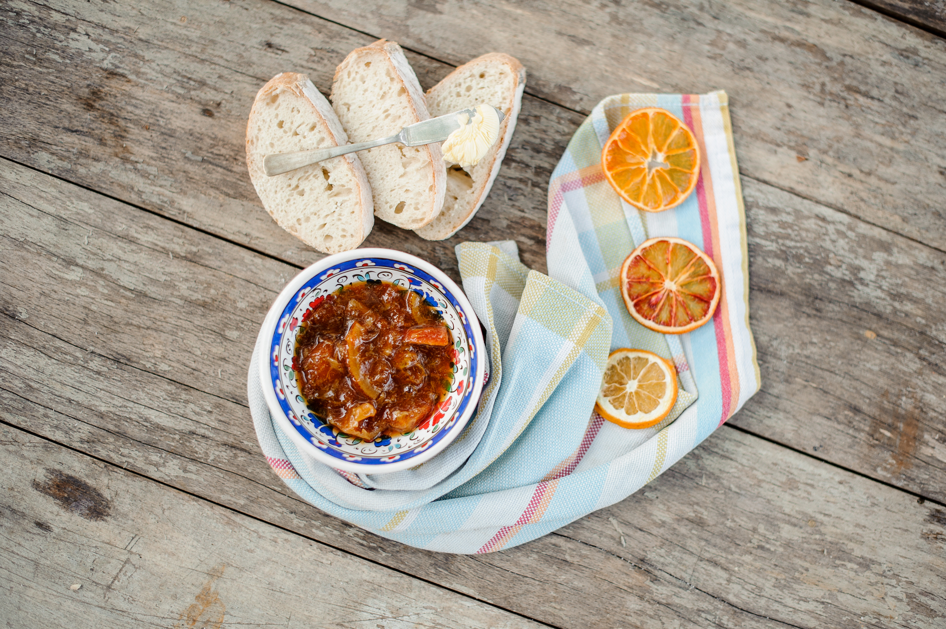 Overhead flat-lay of all ingredients for Fragrant Tunisian Lablabi with Preserved Lemon and Harissa laid out on a kitchen surface.