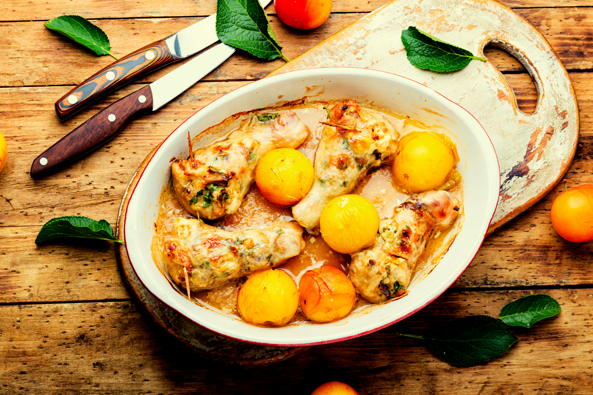 Overhead flat-lay of all ingredients for French Poulet Basquaise laid out on a kitchen surface.