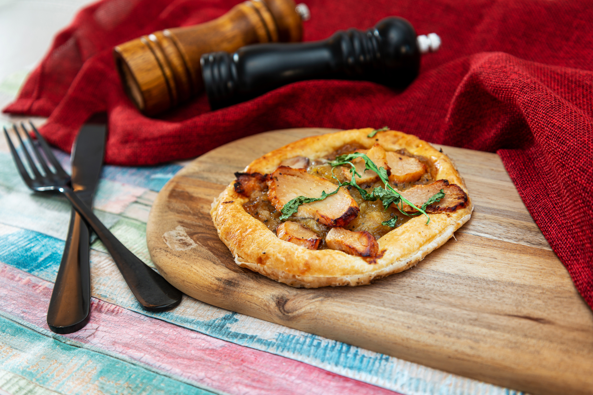 French Tarte Flambée with Onions and Bacon — Appetizer served and photographed from above
