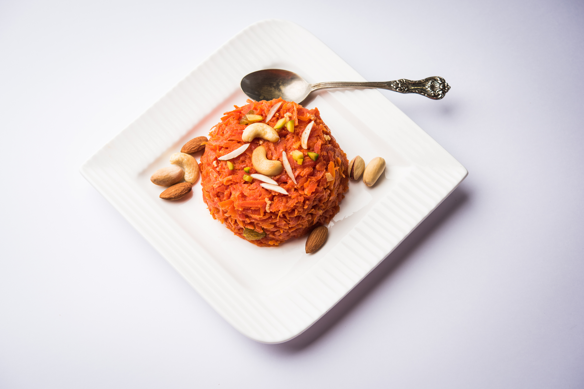Gajar ka Halwa with Saffron and Pine Nuts — Dessert served and photographed from above