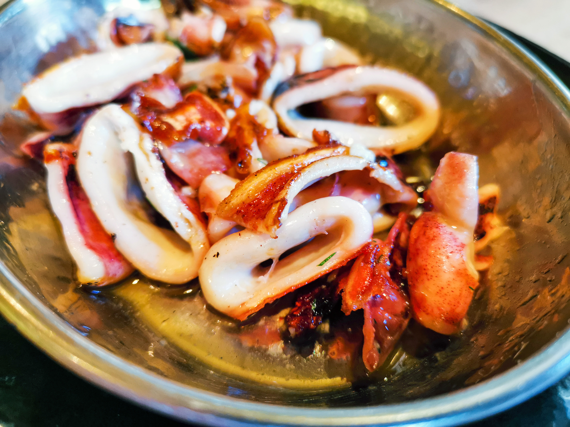 Overhead flat-lay of all ingredients for Galician Pulpo a Feira with Sea Salt and Paprika laid out on a kitchen surface.