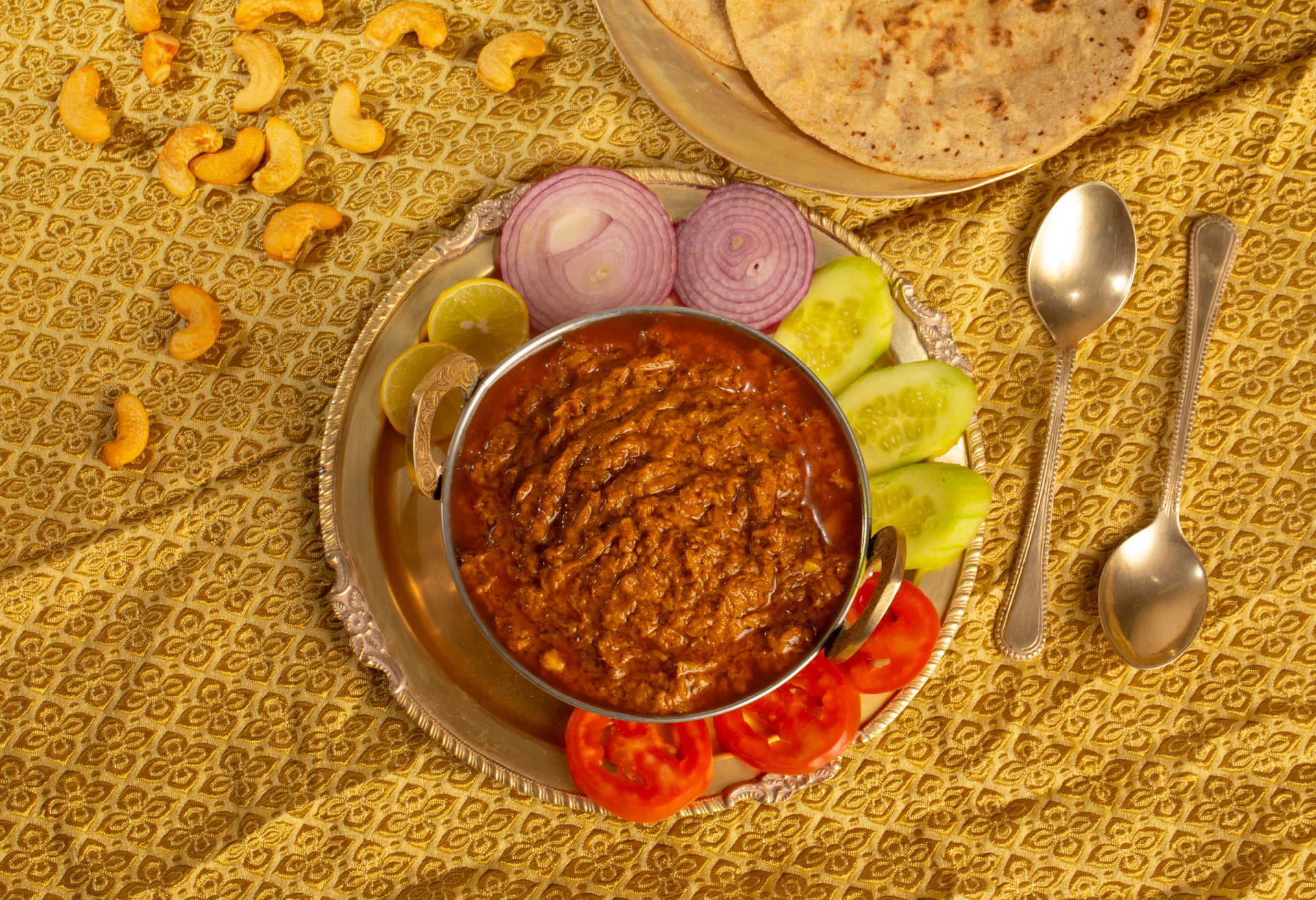 Overhead flat-lay of all ingredients for Gambian Domoda with Peanut Sauce and Beef laid out on a kitchen surface.