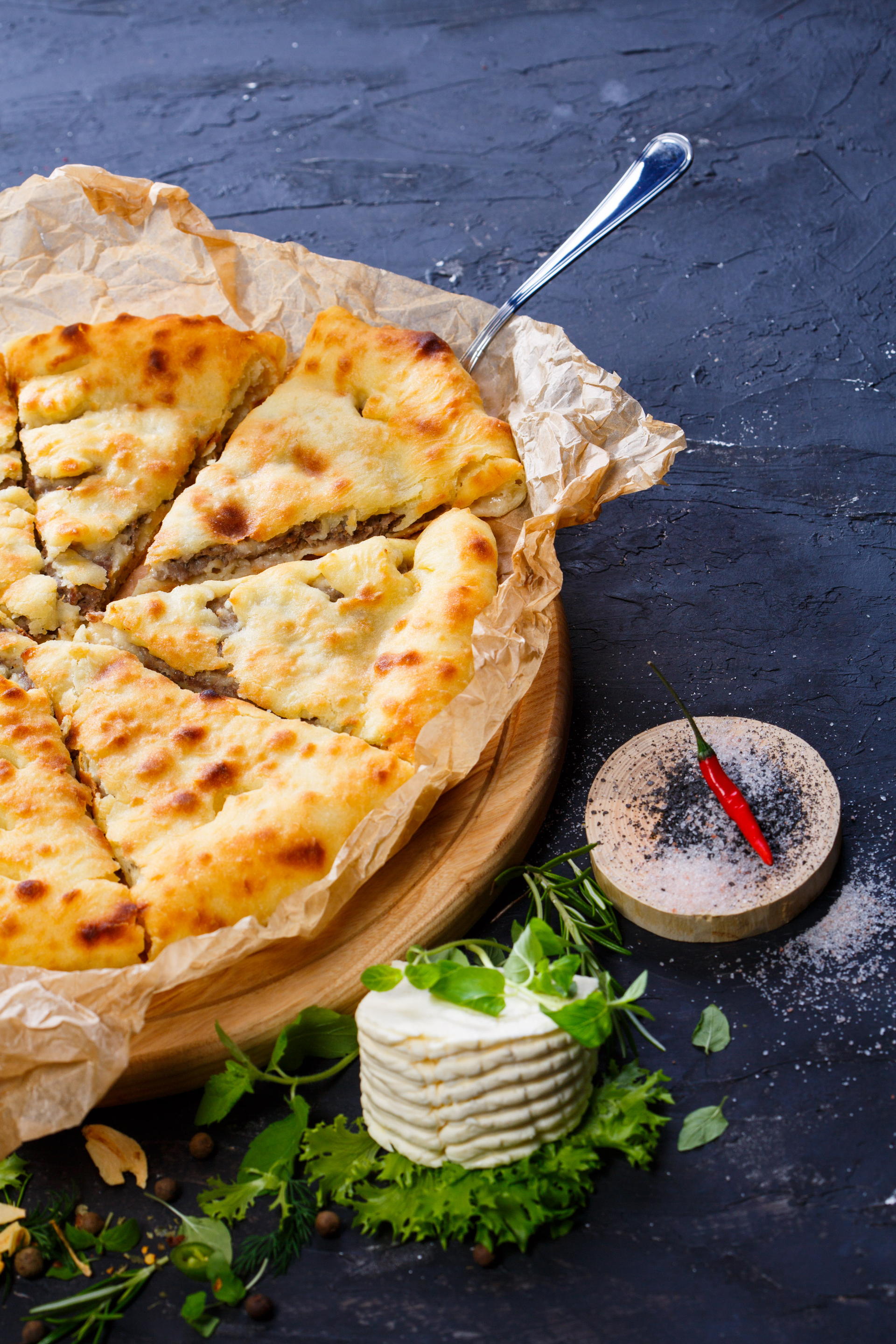 Georgian Khachapuri with Cheese and Green Onions — Appetizer served and photographed from above