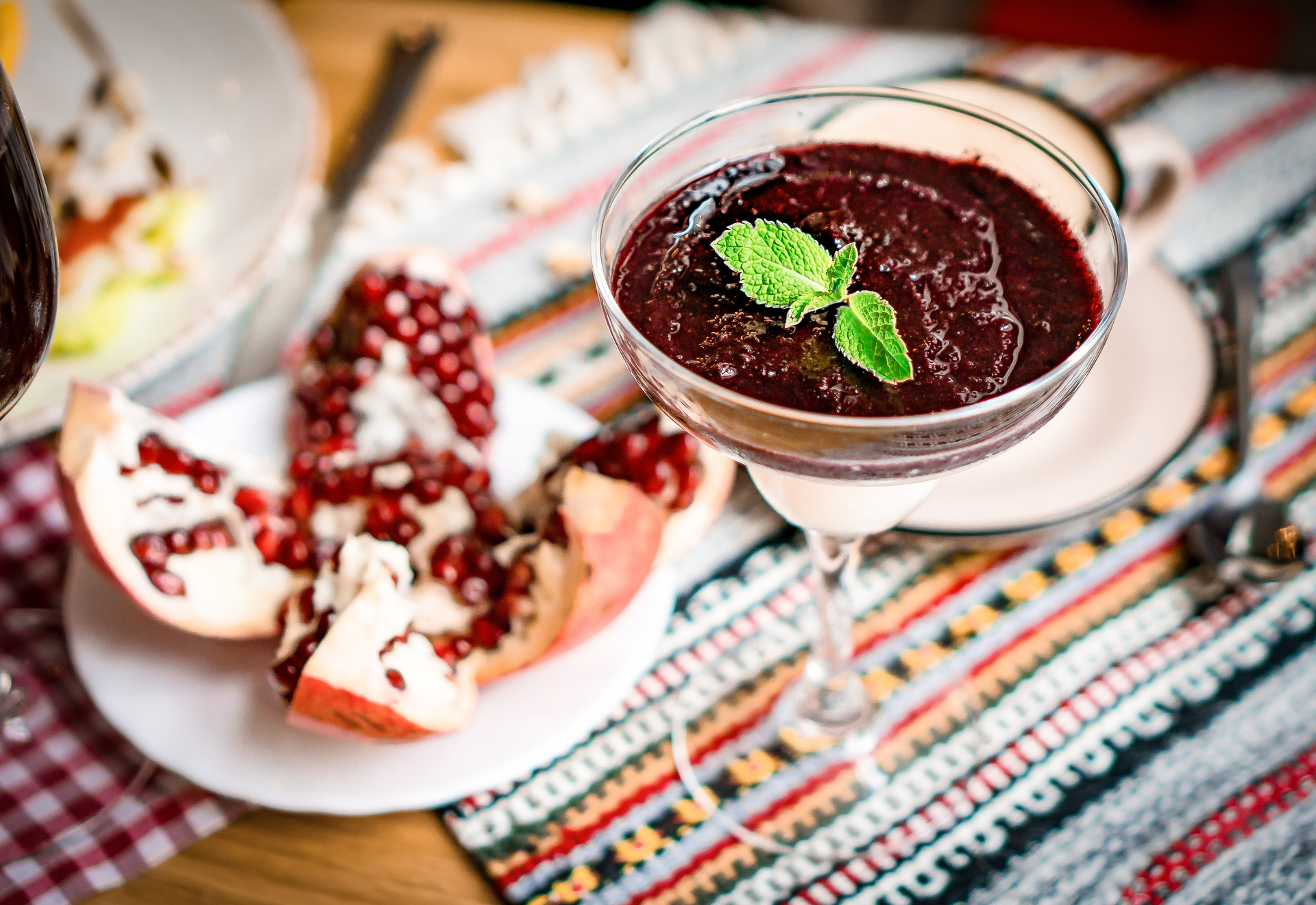 Overhead flat-lay of all ingredients for Georgian Kharcho with Pomegranate Molasses laid out on a kitchen surface.