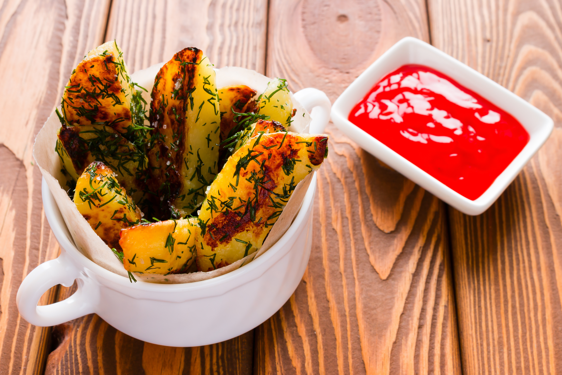 Overhead flat-lay of all ingredients for Ghanaian Red Red with Fried Plantains laid out on a kitchen surface.