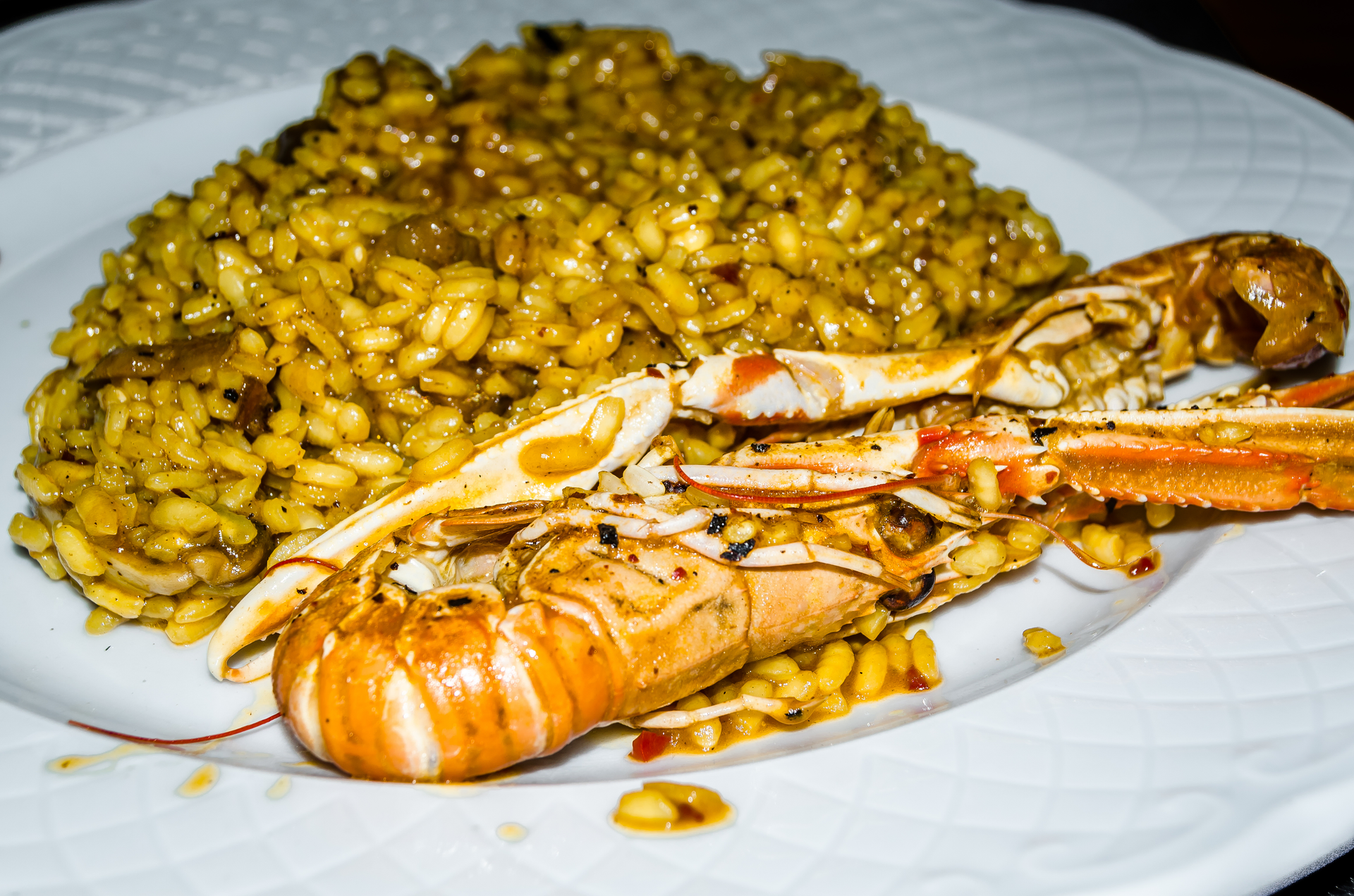Glistening Peruvian Lobster Paella with Saffron Threads — Main Course served and photographed from above