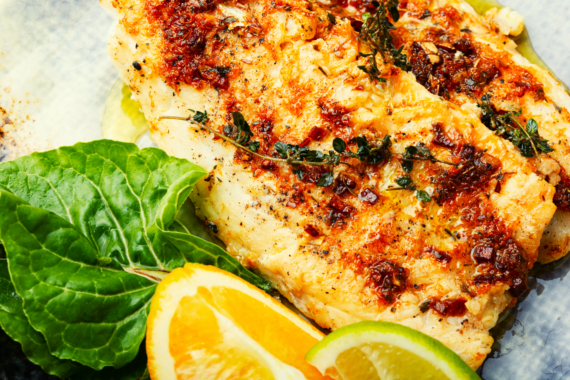 Overhead flat-lay of all ingredients for Greek Aromatic Dill and Lemon Baked Fish with Feta Crumble laid out on a kitchen surface.